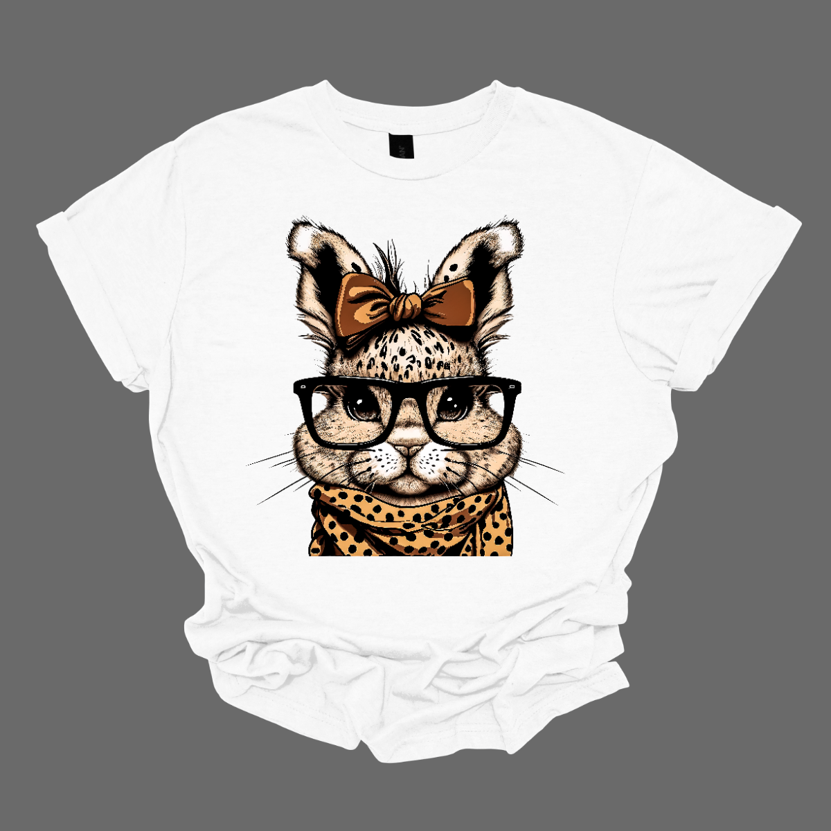 Unleash your wild side this Easter with our charming bunny T-shirt adorned with a cheetah print scarf! This delightful shirt combines the cuteness of a bunny with the fierce elegance of a cheetah, creating a unique and eye-catching design.  Shop now at Gorgeousware.com