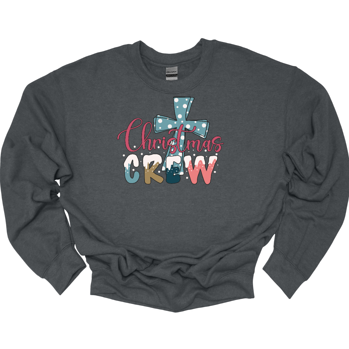 This festive t-shirt features the phrase "Christmas Crew" in a fun, playful font. The letters are adorned with a whimsical snow cap at the top, giving a delightful wintery touch. Behind the text, a bold blue cross serves as a striking backdrop, decorated with cheerful white polka dots that add to the holiday spirit. 