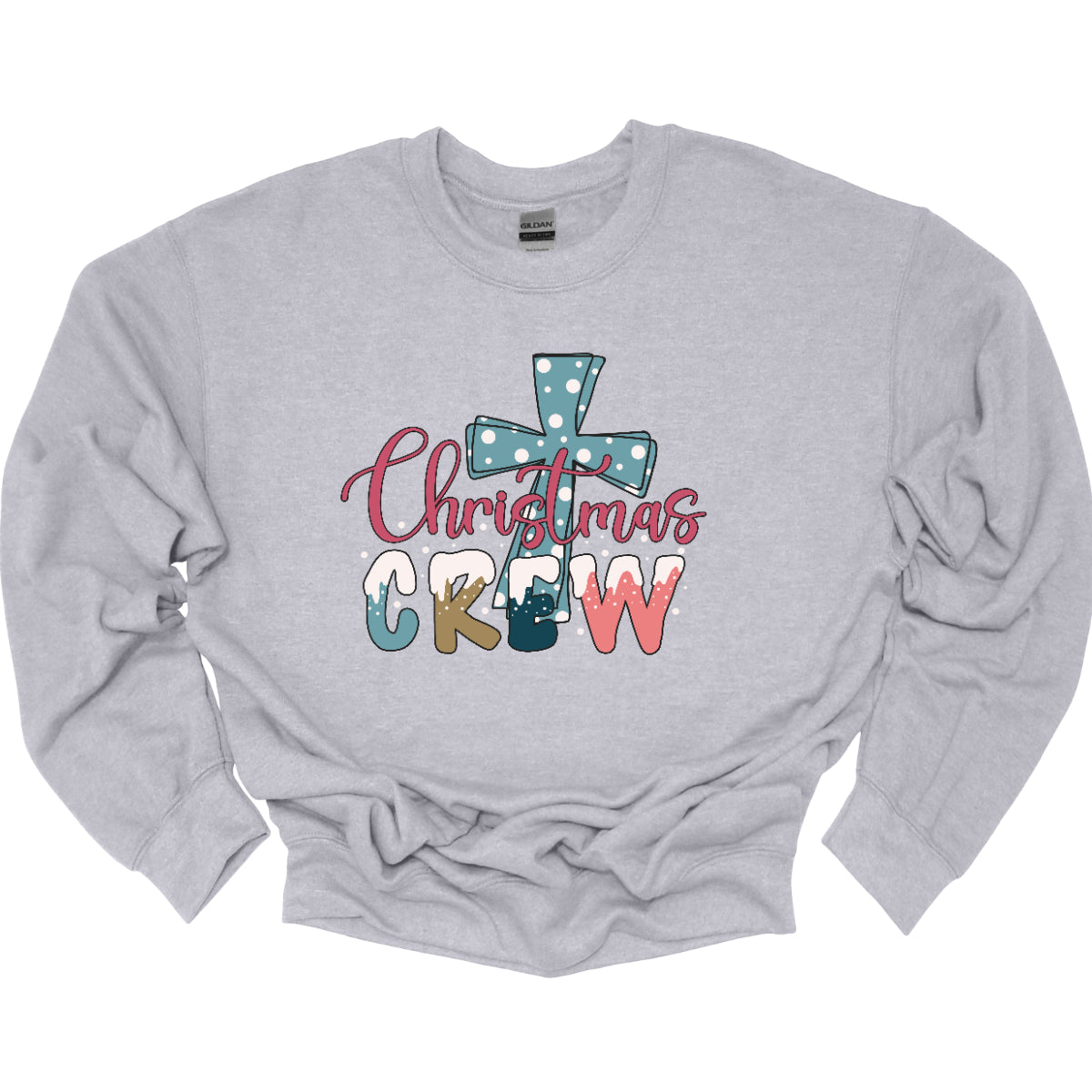 This festive t-shirt features the phrase "Christmas Crew" in a fun, playful font. The letters are adorned with a whimsical snow cap at the top, giving a delightful wintery touch. Behind the text, a bold blue cross serves as a striking backdrop, decorated with cheerful white polka dots that add to the holiday spirit. 