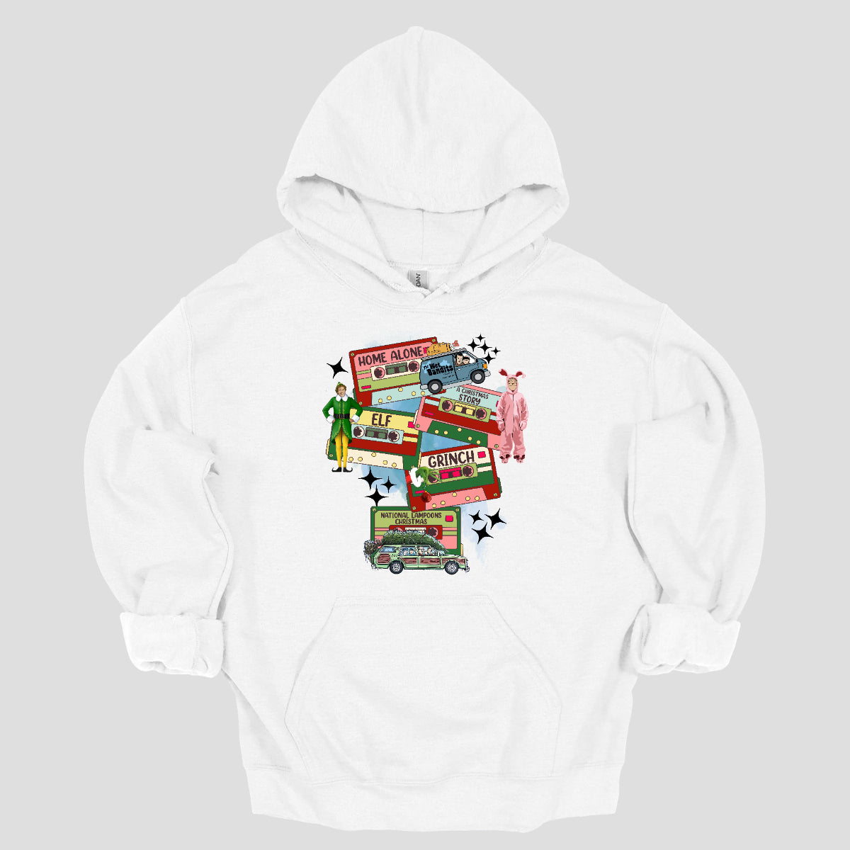 This design t-shirt showcases a nostalgic tribute to classic Christmas movies with a vibrant design featuring beloved characters. Each movie is represented by a unique cartoon illustration Home Alone, A Christmas Story, Elf, The Grinch, and Christmas Vacation. The colorful illustrations are framed by cassette tapes, adding a retro touch that evokes warm memories of holiday movie marathons. Shop Gorgeousware.com