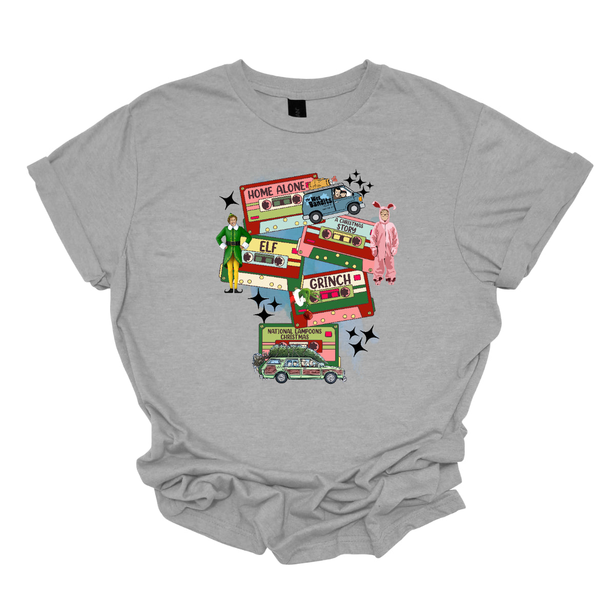 This design t-shirt showcases a nostalgic tribute to classic Christmas movies with a vibrant design featuring beloved characters. Each movie is represented by a unique cartoon illustration Home Alone, A Christmas Story, Elf, The Grinch, and Christmas Vacation. The colorful illustrations are framed by cassette tapes, adding a retro touch that evokes warm memories of holiday movie marathons. Shop Gorgeousware.com