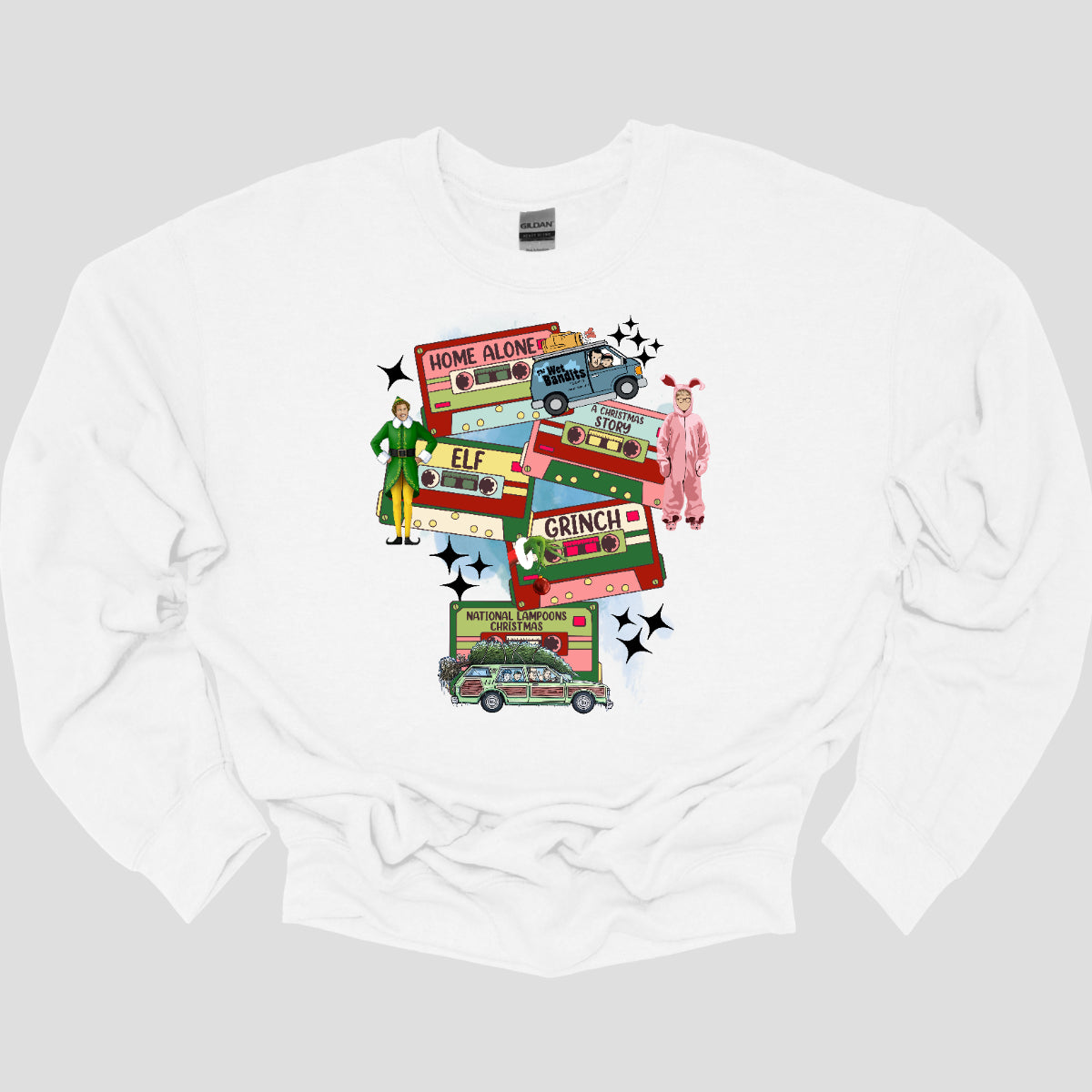 This design t-shirt showcases a nostalgic tribute to classic Christmas movies with a vibrant design featuring beloved characters. Each movie is represented by a unique cartoon illustration Home Alone, A Christmas Story, Elf, The Grinch, and Christmas Vacation. The colorful illustrations are framed by cassette tapes, adding a retro touch that evokes warm memories of holiday movie marathons. Shop Gorgeousware.com