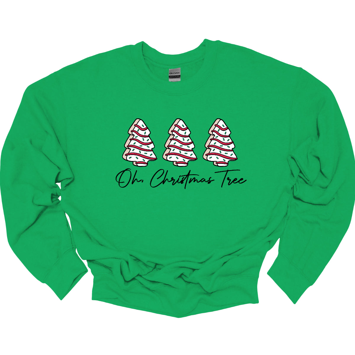 This t-shirt features a whimsical holiday design that’s perfect for spreading cheer. The shirt is adorned with the phrase “Oh Christmas Tree” written in elegant black cursive font, adding a touch of sophistication to the festive message. Above the words, three iconic Christmas tree snack cakes are illustrated, each depicted with their classic, playful decorations. Shop Gorgeousware.com