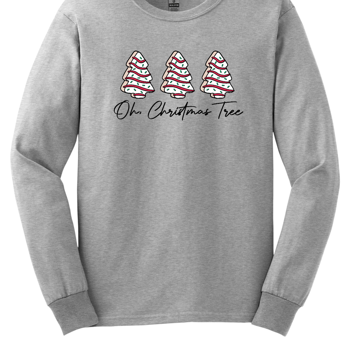 This t-shirt features a whimsical holiday design that’s perfect for spreading cheer. The shirt is adorned with the phrase “Oh Christmas Tree” written in elegant black cursive font, adding a touch of sophistication to the festive message. Above the words, three iconic Christmas tree snack cakes are illustrated, each depicted with their classic, playful decorations. Shop Gorgeousware.com