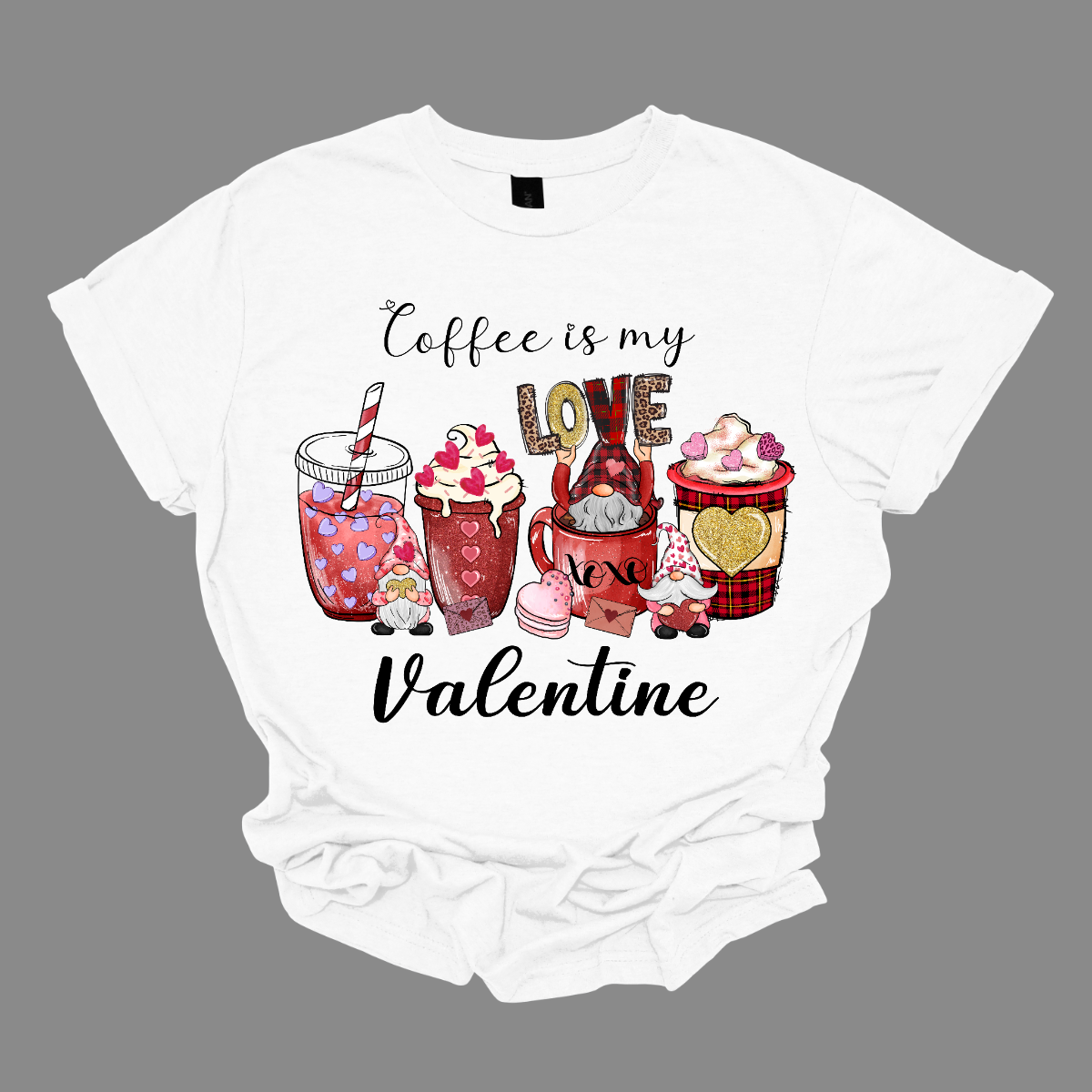 Introducing our "Coffee Is My Valentine" T-shirt featuring charming gnomes – a delightful and whimsical garment for those who've found true love in a cup of coffee. This shirt is a playful celebration of the bond between coffee lovers and their beloved brew, with the added charm of adorable gnomes.  The design showcases enchanting gnomes enjoying their coffee, creating a heartwarming scene that captures the joy and affection coffee brings into our lives. Shop at Gorgeousware.com