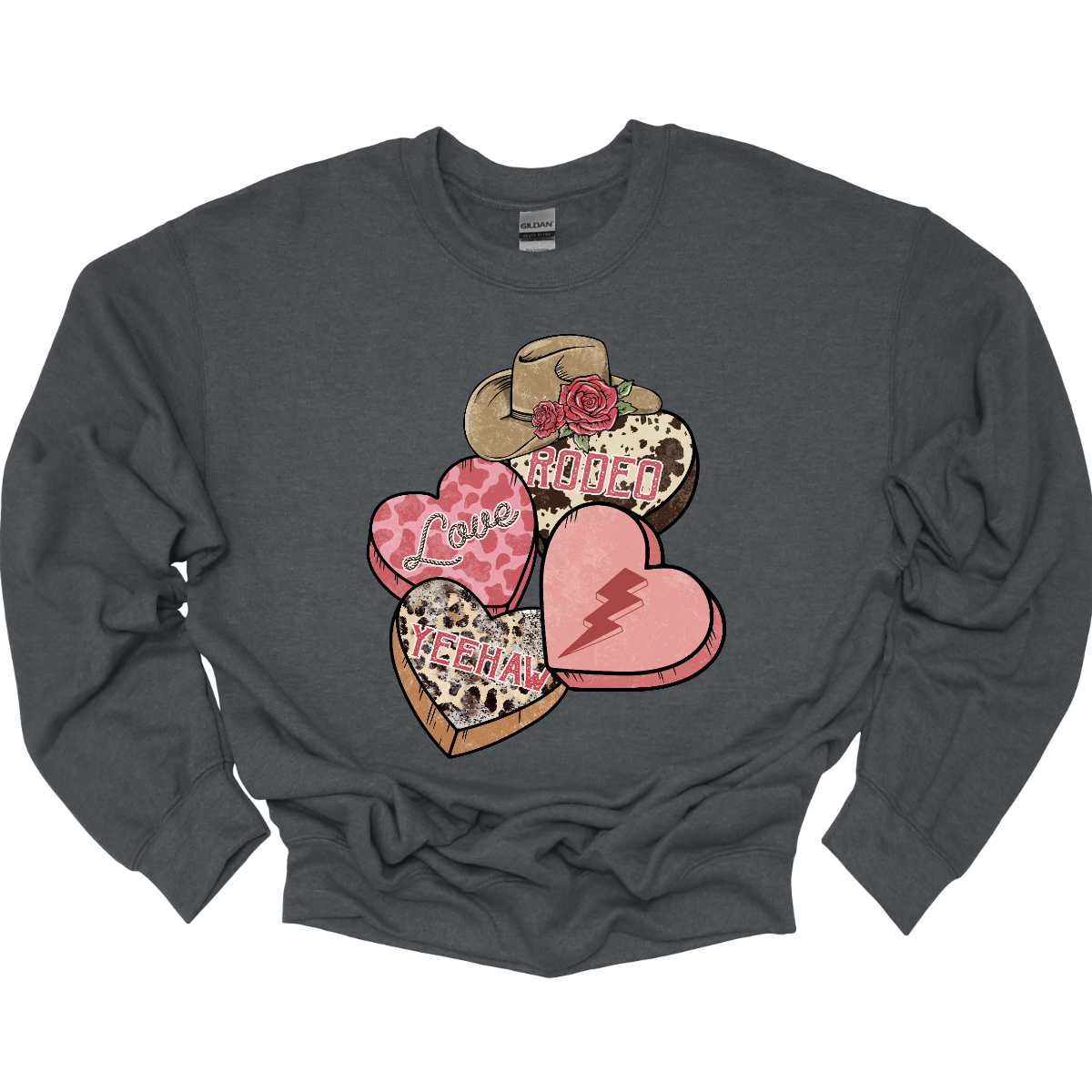 Wear your heart on your sleeve with our "Heartfelt Rodeo Expressions" T-shirt – a charming and energetic garment that beautifully combines the sweetness of conversation hearts with the rugged excitement of the rodeo. Perfect for those who want to express their love for the Western lifestyle with a playful and stylish twist. Shop at Gorgeousware.com