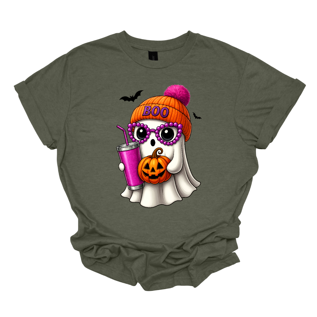 Bring on the spooky-cute vibes with this adorable fall tee! 👻🎃 The design features a sweet little ghost bundled up in an orange sock cap with a pink pom on top. The flipped brim of the hat reads “BOO” for a playful touch. This stylish ghost also sports purple reading glasses, holds a matching purple drink cup, and carries a tiny jack-o’-lantern bucket — ready for all the fall fun! Two little bats flutter in the background to complete the whimsical Halloween scene. Gorgeousware.com