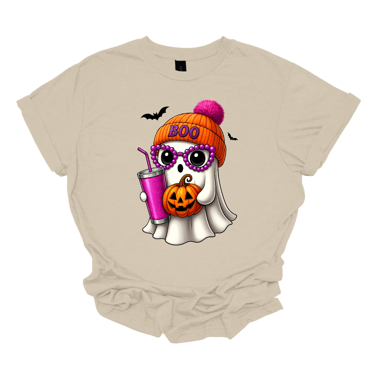 Bring on the spooky-cute vibes with this adorable fall tee! 👻🎃 The design features a sweet little ghost bundled up in an orange sock cap with a pink pom on top. The flipped brim of the hat reads “BOO” for a playful touch. This stylish ghost also sports purple reading glasses, holds a matching purple drink cup, and carries a tiny jack-o’-lantern bucket — ready for all the fall fun! Two little bats flutter in the background to complete the whimsical Halloween scene. Gorgeousware.com