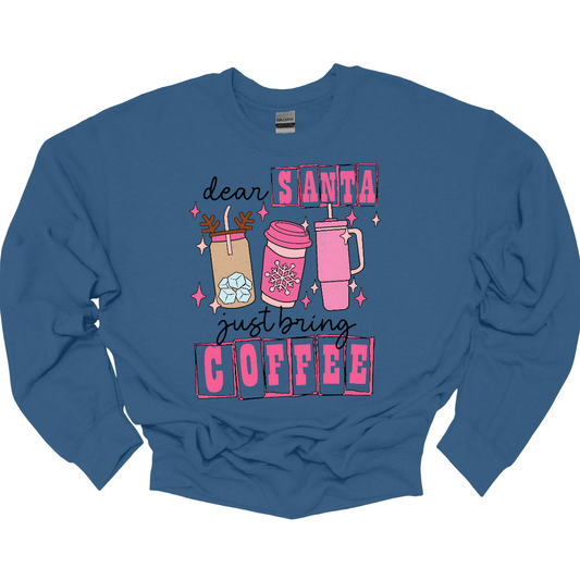 holiday season isn't complete without a little caffeine boost! The design features the cheeky phrase, "Dear Santa, Just bring coffee", in bold, fun lettering. The words "Santa" and "coffee" are highlighted with hot pink block-outlined boxes, adding a pop of color and flair to the design. Shop at Gorgeousware.com