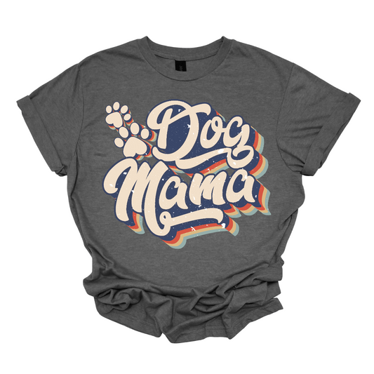 This shirt features the playful and stylish saying "Retro Dog Mama" in large, bold letters, designed to catch the eye with a vintage-inspired font. The letters are printed in a fun, retro style, evoking a sense of nostalgia. Alongside the text, there are cute paw prints scattered throughout the design, adding a touch of whimsy and highlighting the dog lover theme. Shop Gorgeousware.com