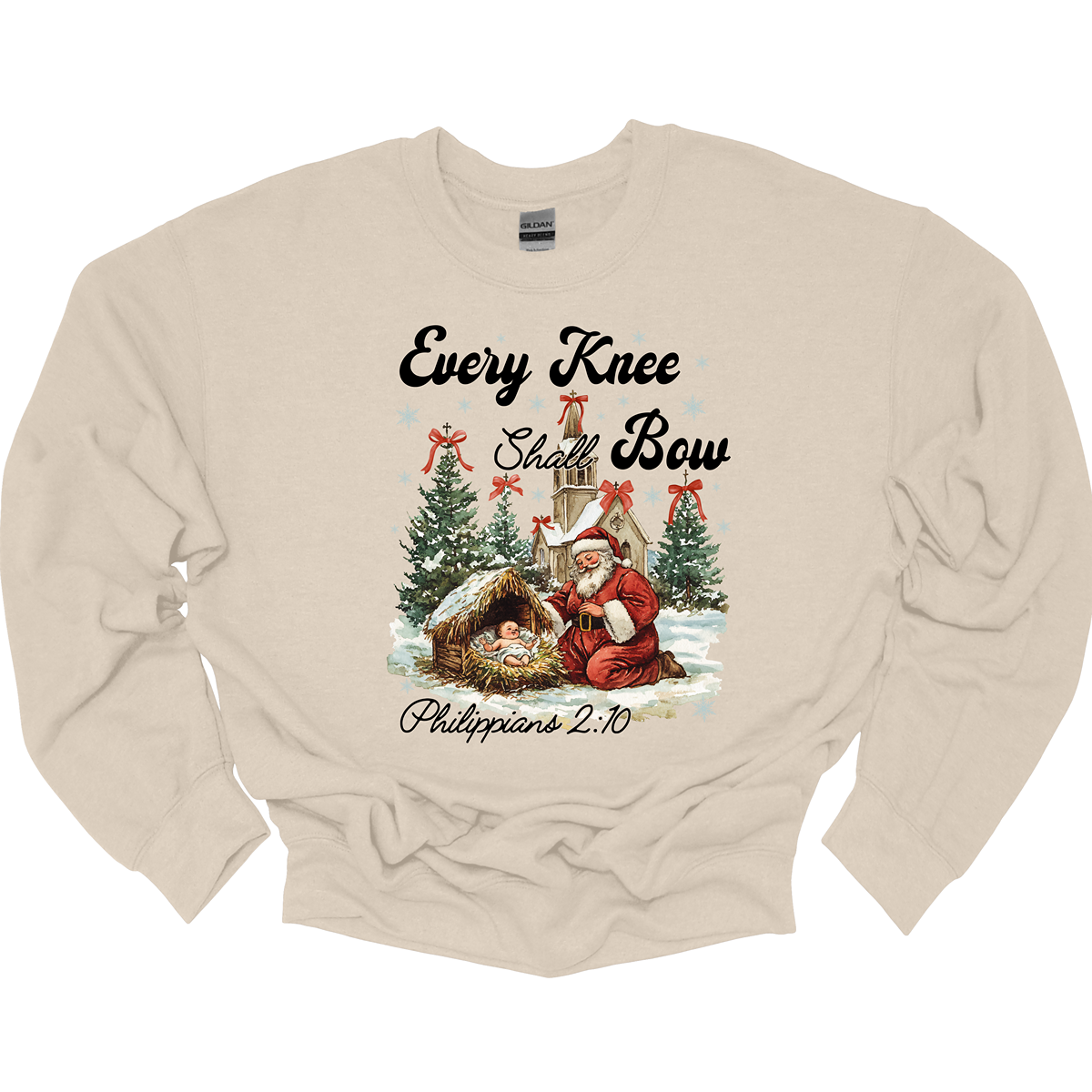 This festive and powerful apparel design features the phrase "Every Knee Shall Bow" in bold, elegant lettering, symbolizing the reverence and humility of the Christmas story. The artwork showcases Santa Claus, traditionally known for his joyful spirit, bowing down in awe before a humble manger that cradles baby Jesus. In the background, an old chapel stands as a symbol of faith, with evergreen trees adorned with festive bows, adding a touch of seasonal beauty and serenity.  Shop at Gorgeousware.com