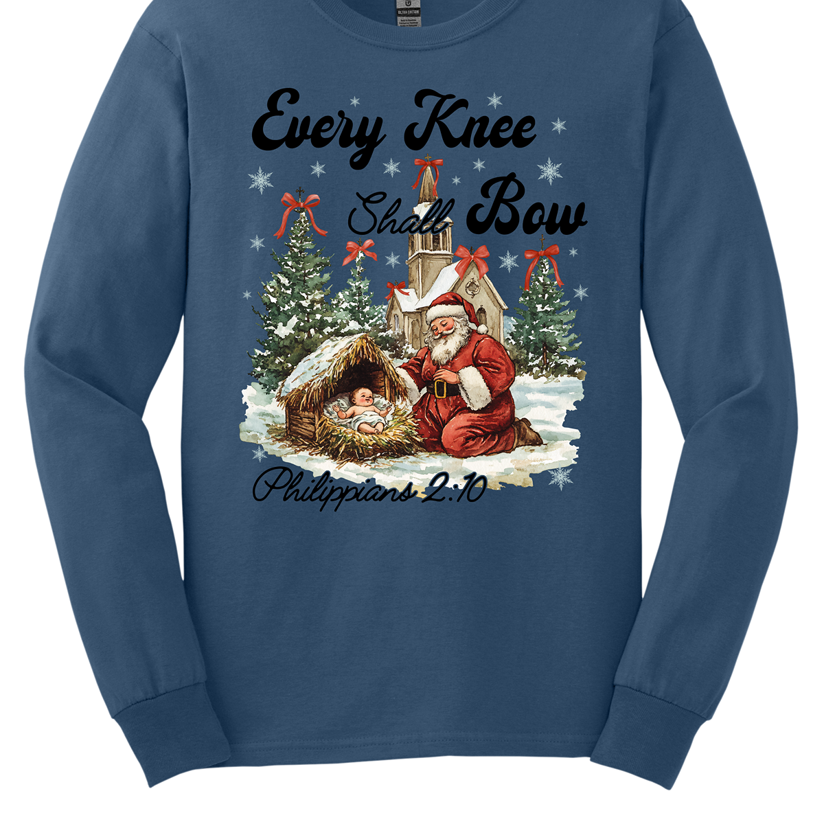 This festive and powerful apparel design features the phrase "Every Knee Shall Bow" in bold, elegant lettering, symbolizing the reverence and humility of the Christmas story. The artwork showcases Santa Claus, traditionally known for his joyful spirit, bowing down in awe before a humble manger that cradles baby Jesus. In the background, an old chapel stands as a symbol of faith, with evergreen trees adorned with festive bows, adding a touch of seasonal beauty and serenity.  Shop at Gorgeousware.com