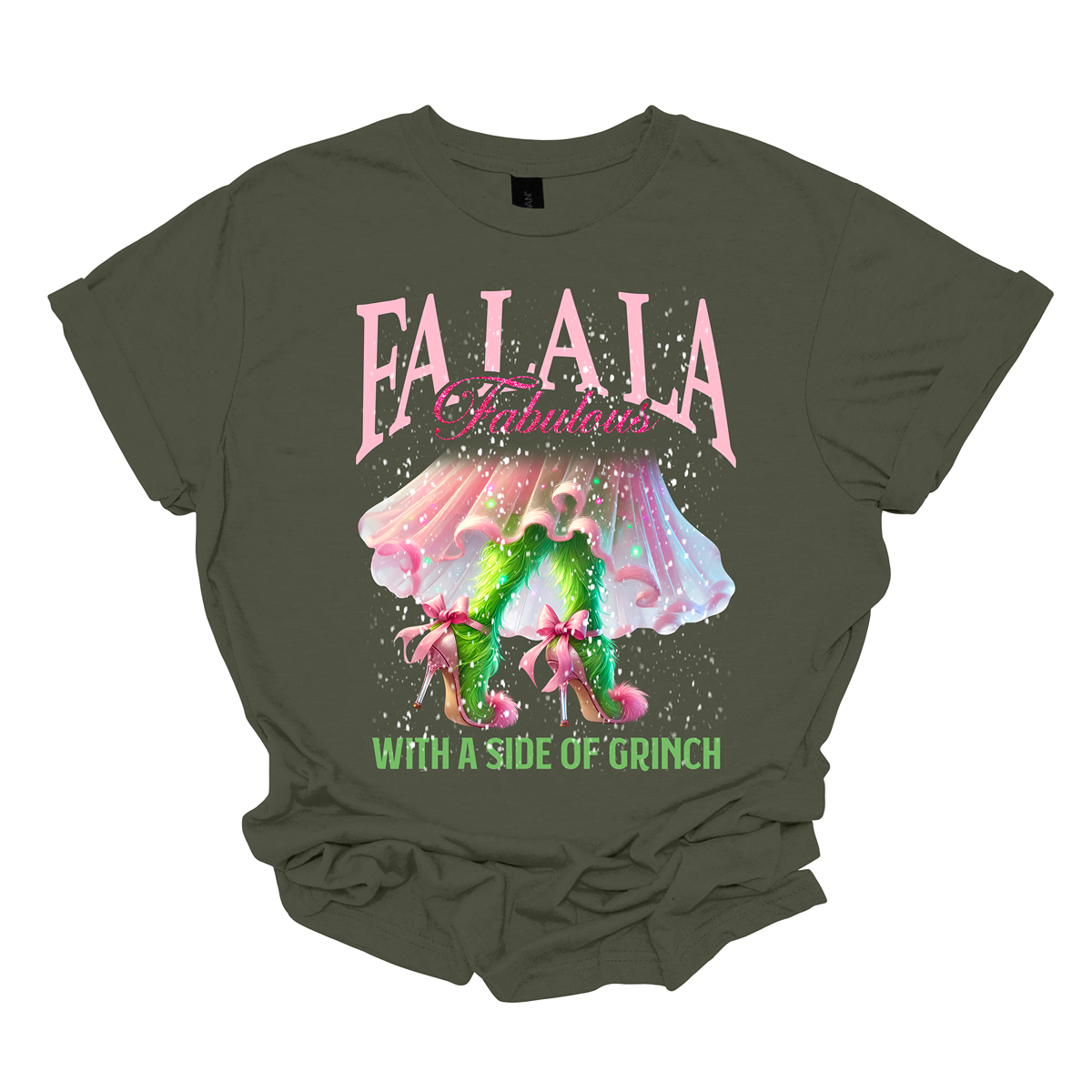 The design features a playful and festive take on the Grinch character with a stylish twist. The phrase "Fa La La Fabulous" is at the top in a fun, cursive font with a bouncy, holiday-inspired feel. The word "Fabulous" stands out in bold, glamorous lettering with subtle sparkles, giving it a chic vibe. Below, the Grinch is shown with her girly green legs, styled in light pink high heels adorned with oversized bows at the back, adding a sweet and fashionable touch. Shop at Gorgeousware.com