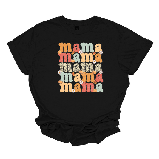 The t-shirt features the word "Mama" stacked vertically five times, each instance showcasing a different design element. The central "Mama" stands out prominently in a cheetah print pattern, adding a bold and trendy touch to the design. Shop Gorgeousware.com