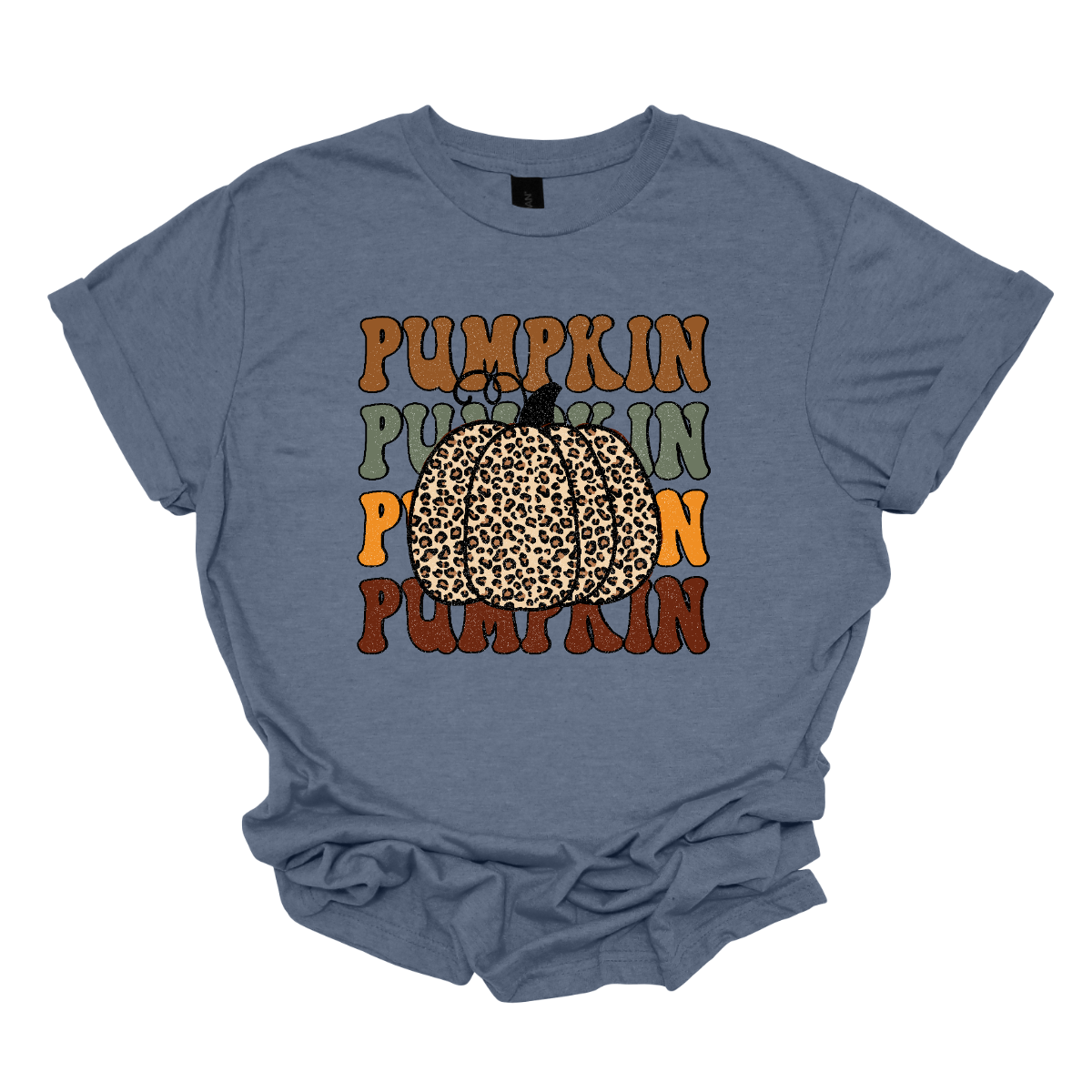 The t-shirt features the word "Pumpkin" repeated four times vertically down the center. Each instance of "Pumpkin" is rendered in a distinct fall color. The colors include rich oranges, deep reds, golden yellows, and warm browns, evoking the vibrant hues of autumn. At the top of these stacked words, there is a large, eye-catching pumpkin illustrated in bold cheetah print. The cheetah print design on the pumpkin adds a playful and trendy twist. Shop Gorgeousware.com