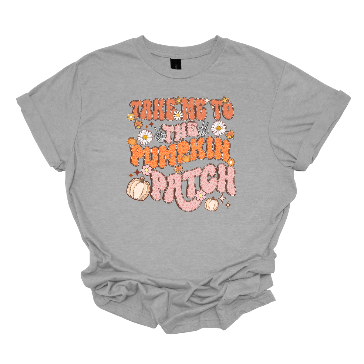 The t-shirt design features the playful phrase "Take Me to the Pumpkin Patch" in a stylish retro font. The text is rendered in a delightful combination of orange and pink pastel cheetah print, giving it a trendy and eye-catching look with a touch of whimsy. Shop Gorgousware.com