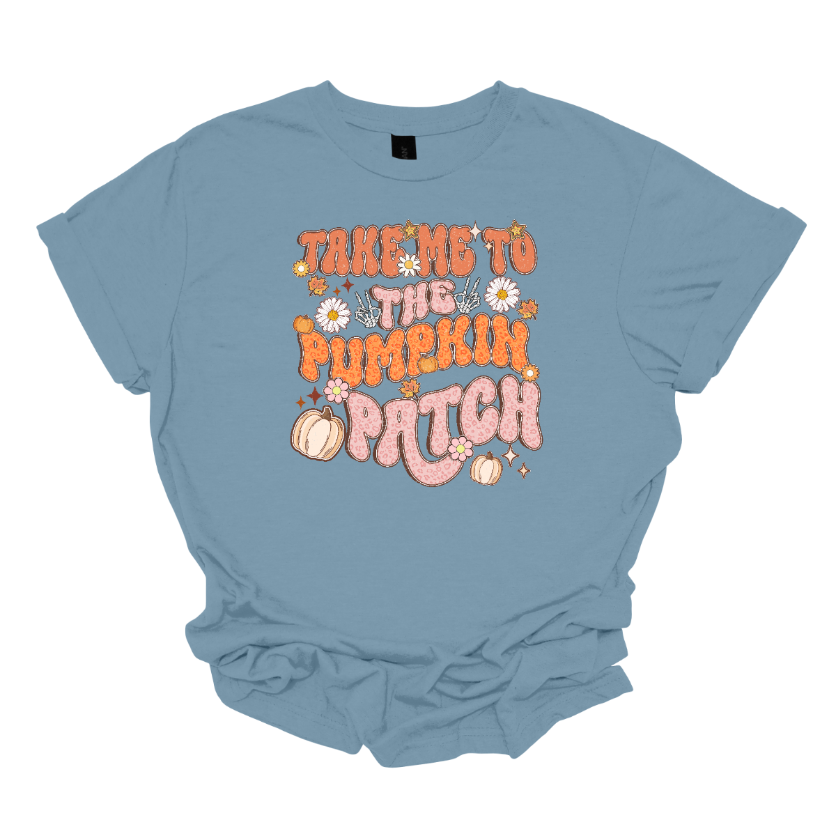 The t-shirt design features the playful phrase "Take Me to the Pumpkin Patch" in a stylish retro font. The text is rendered in a delightful combination of orange and pink pastel cheetah print, giving it a trendy and eye-catching look with a touch of whimsy. Shop Gorgousware.com