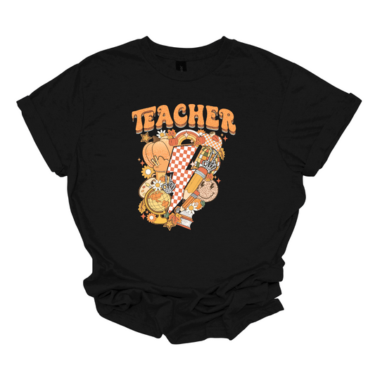 The t-shirt features a vibrant and engaging design centered around the word "Teacher." The word "Teacher" is prominently displayed in a retro-inspired font that’s bold and orange, evoking a nostalgic and energetic feel.

Beneath the word "Teacher," there’s a striking graphic of a large orange and white checkerboard lightning bolt. The lightning bolt adds a dynamic and eye-catching element to the design, with its bold checkerboard pattern creating a strong visual impact. Shop Gorgeousware.com