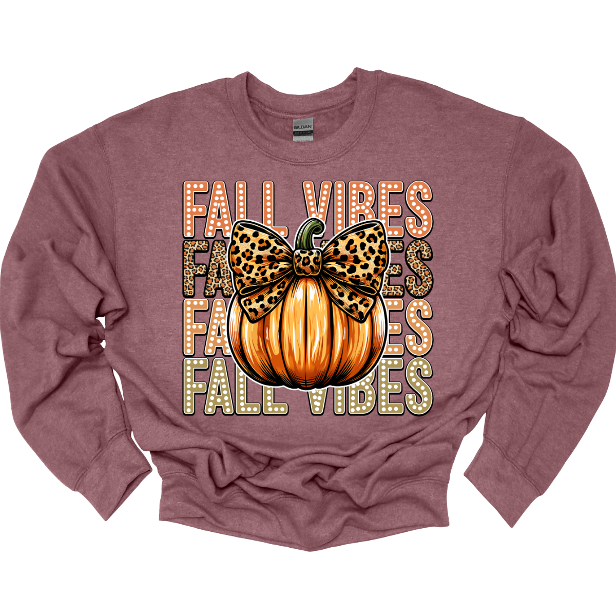 Embrace the cozy charm of autumn with our "Fall Designs" t-shirt! This playful design features the phrase "Fall Designs" stacked vertically, with vibrant fall colors bringing each letter to life in a charming white dot font. At the heart of the design, a whimsical pumpkin with a cute cheetah print bow adds a touch of playful flair. Shop at Gorgeousware.com