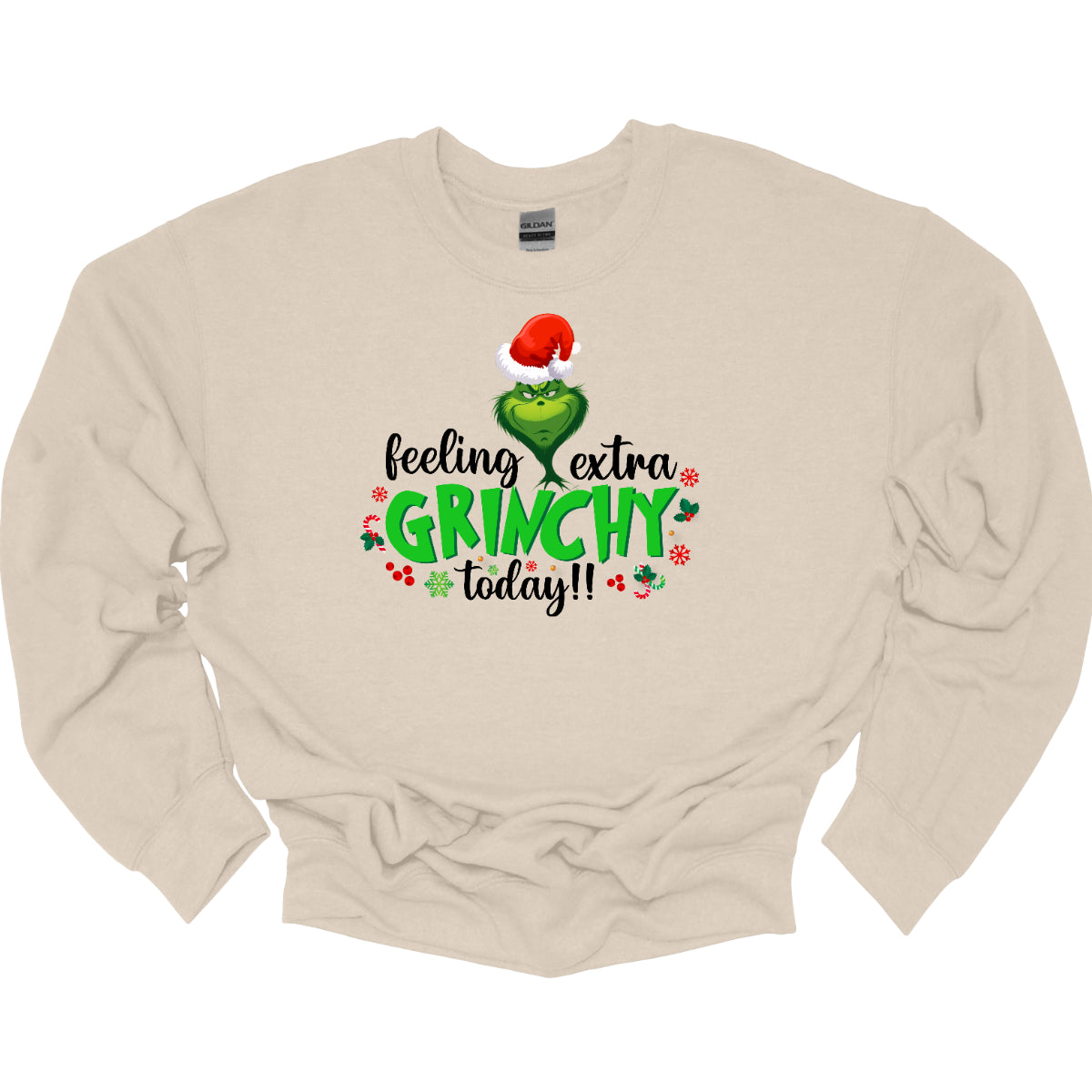 This T-shirt design exudes festive cheer and playful humor with its vibrant and eye-catching elements. The front of the shirt features the phrase, "Feeling extra grinchy today!!" prominently displayed in a fun and engaging. Shop Gorgeousware.com