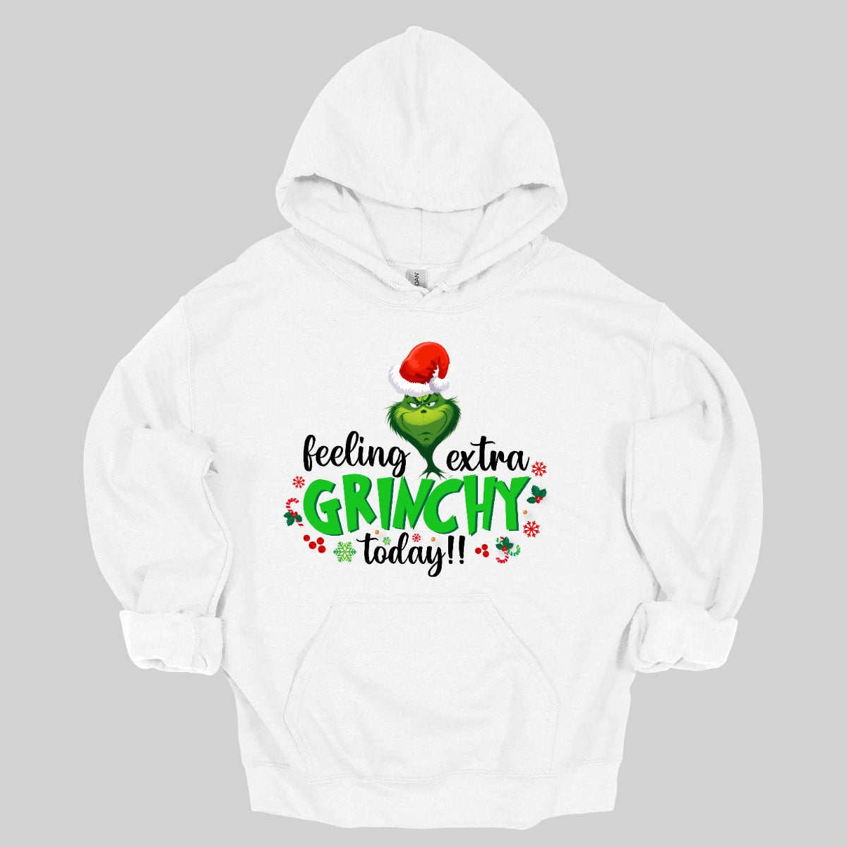 This T-shirt design exudes festive cheer and playful humor with its vibrant and eye-catching elements. The front of the shirt features the phrase, "Feeling extra grinchy today!!" prominently displayed in a fun and engaging. Shop Gorgeousware.com