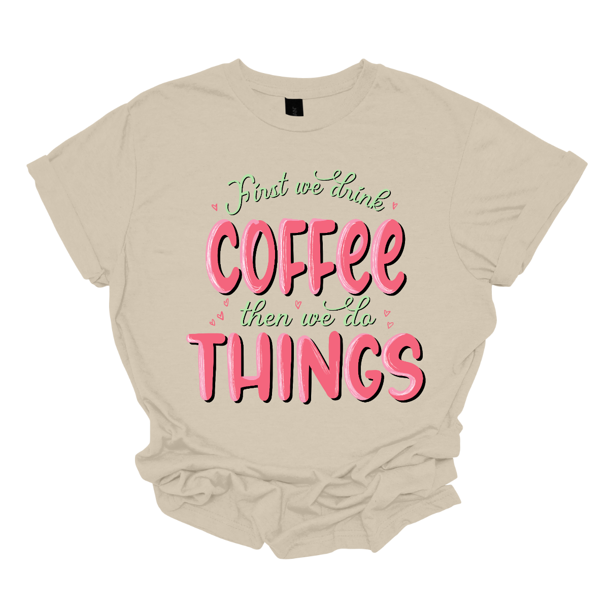 A playful and relatable garment for those who understand the importance of starting the day right. This shirt is a witty declaration that coffee is the essential first step before diving into the hustle and bustle of daily activities. The design features a clever and eye-catching arrangement of the phrase "First We Do Coffee, Then We Do Things," playfully emphasizing the priority of enjoying a cup of coffee before tackling the tasks of the day. Shop at Gorgeousware.com