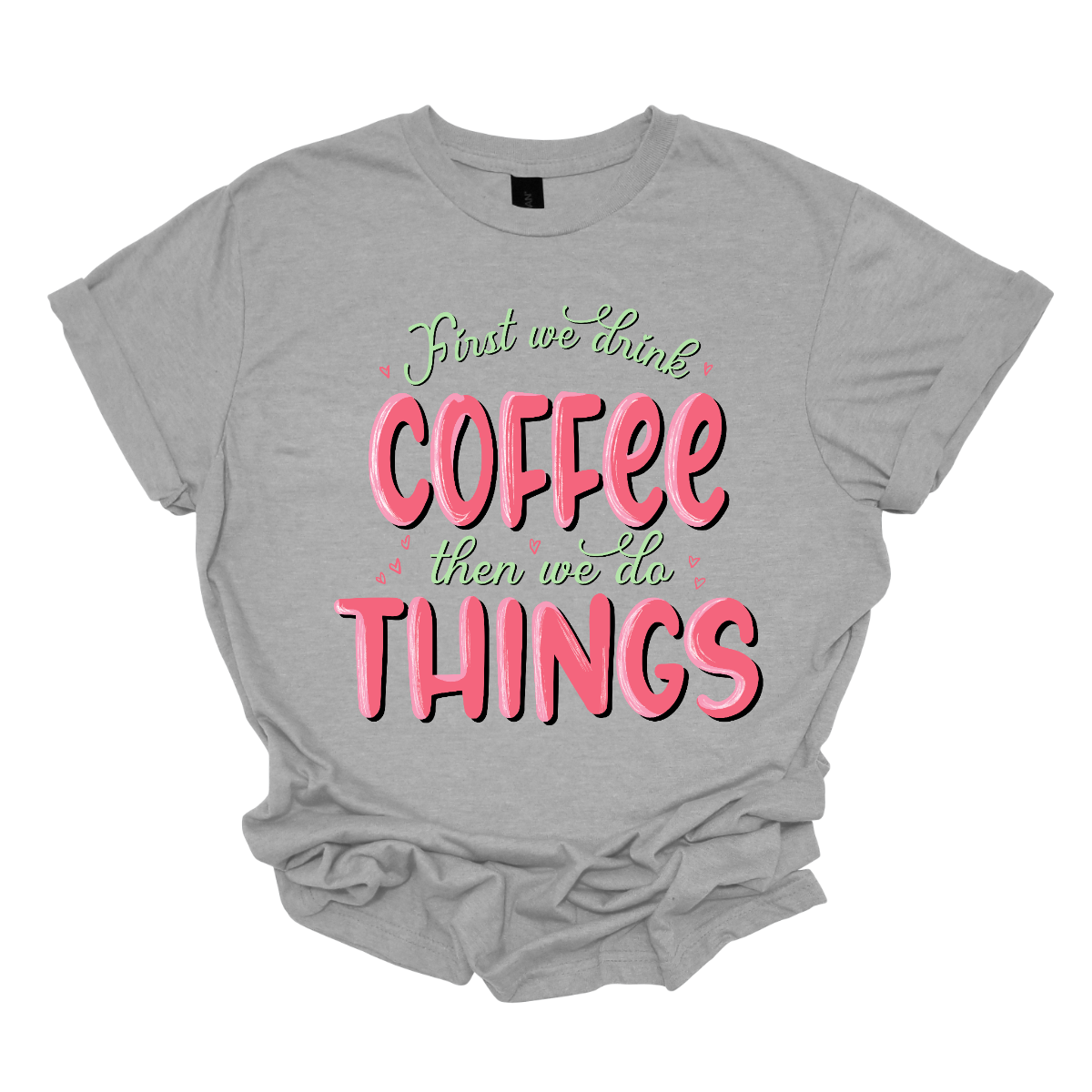 A playful and relatable garment for those who understand the importance of starting the day right. This shirt is a witty declaration that coffee is the essential first step before diving into the hustle and bustle of daily activities. The design features a clever and eye-catching arrangement of the phrase "First We Do Coffee, Then We Do Things," playfully emphasizing the priority of enjoying a cup of coffee before tackling the tasks of the day. Shop at Gorgeousware.com