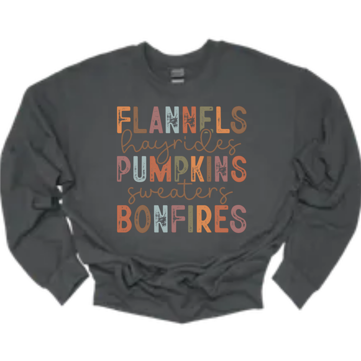 Get into the autumn spirit with our 'Fall Favorites' tee, featuring a dynamic design that celebrates all things cozy and festive! The shirt showcases the words 'Flannels,' 'Hayrides,' 'Pumpkins,' 'Sweaters,' and 'Bonfires,' each in a unique font style—from grunge print to elegant cursive. The vibrant, alternating colors add a playful touch to the design, capturing the essence of fall’s rich palette. Shop at Gorgeousware.com