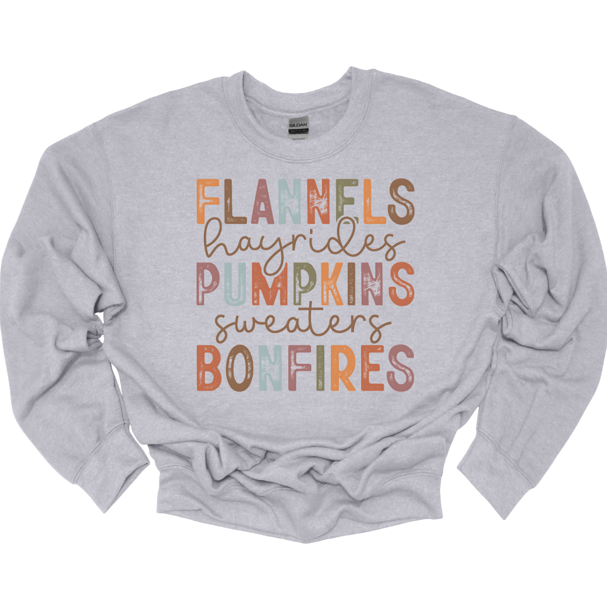 Get into the autumn spirit with our 'Fall Favorites' tee, featuring a dynamic design that celebrates all things cozy and festive! The shirt showcases the words 'Flannels,' 'Hayrides,' 'Pumpkins,' 'Sweaters,' and 'Bonfires,' each in a unique font style—from grunge print to elegant cursive. The vibrant, alternating colors add a playful touch to the design, capturing the essence of fall’s rich palette. Shop at Gorgeousware.com