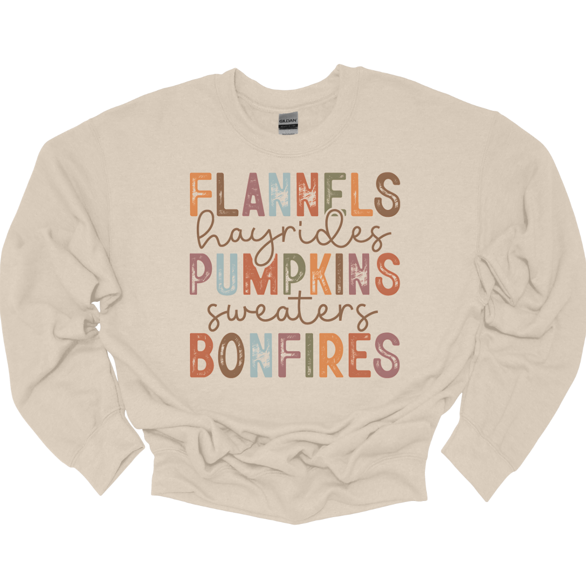 Get into the autumn spirit with our 'Fall Favorites' tee, featuring a dynamic design that celebrates all things cozy and festive! The shirt showcases the words 'Flannels,' 'Hayrides,' 'Pumpkins,' 'Sweaters,' and 'Bonfires,' each in a unique font style—from grunge print to elegant cursive. The vibrant, alternating colors add a playful touch to the design, capturing the essence of fall’s rich palette. Shop at Gorgeousware.com