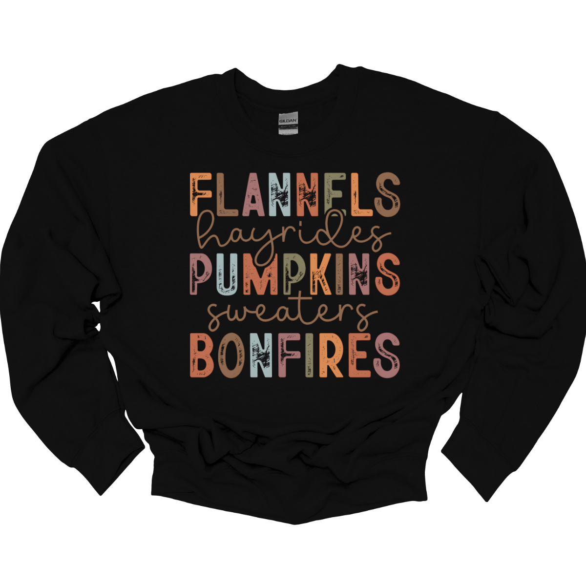 Get into the autumn spirit with our 'Fall Favorites' tee, featuring a dynamic design that celebrates all things cozy and festive! The shirt showcases the words 'Flannels,' 'Hayrides,' 'Pumpkins,' 'Sweaters,' and 'Bonfires,' each in a unique font style—from grunge print to elegant cursive. The vibrant, alternating colors add a playful touch to the design, capturing the essence of fall’s rich palette. Shop at Gorgeousware.com