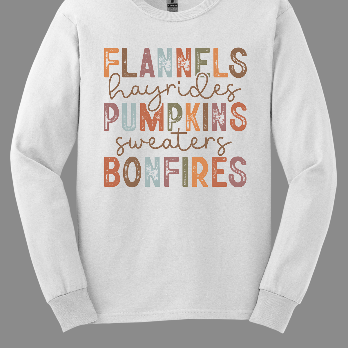 Get into the autumn spirit with our 'Fall Favorites' tee, featuring a dynamic design that celebrates all things cozy and festive! The shirt showcases the words 'Flannels,' 'Hayrides,' 'Pumpkins,' 'Sweaters,' and 'Bonfires,' each in a unique font style—from grunge print to elegant cursive. The vibrant, alternating colors add a playful touch to the design, capturing the essence of fall’s rich palette. Shop at Gorgeousware.com