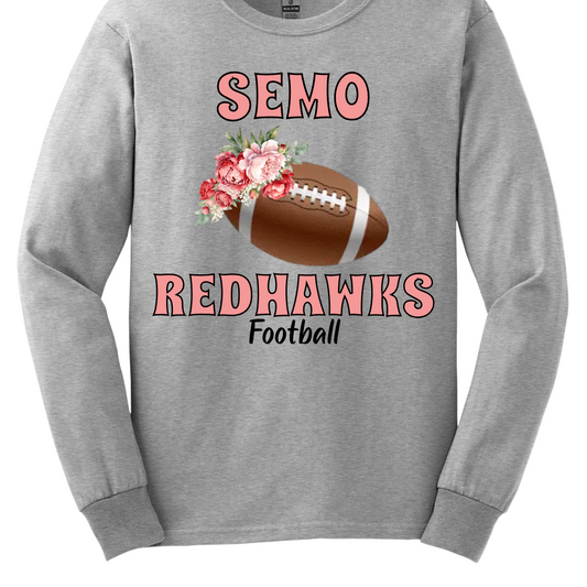 This SEMO shirt features bold pink SEMO Redhawks lettering across the front, making your pride stand out in eye-catching fashion. A detailed football is accented with delicate flowers adds a unique, feminine twist, while the finishing touch of bold black Football lettering ties the look together. This design blends fierce Redhawk energy with a soft, stylish edge.
Shop at Gorgeousware.com today!

