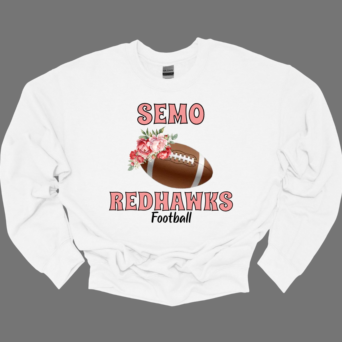 This SEMO crewneck features bold pink SEMO Redhawks lettering across the front, making your pride stand out in eye-catching fashion. A detailed football is accented with delicate flowers adds a unique, feminine twist, while the finishing touch of bold black Football lettering ties the look together. This design blends fierce Redhawk energy with a soft, stylish edge.
Shop at Gorgeousware.com today!
