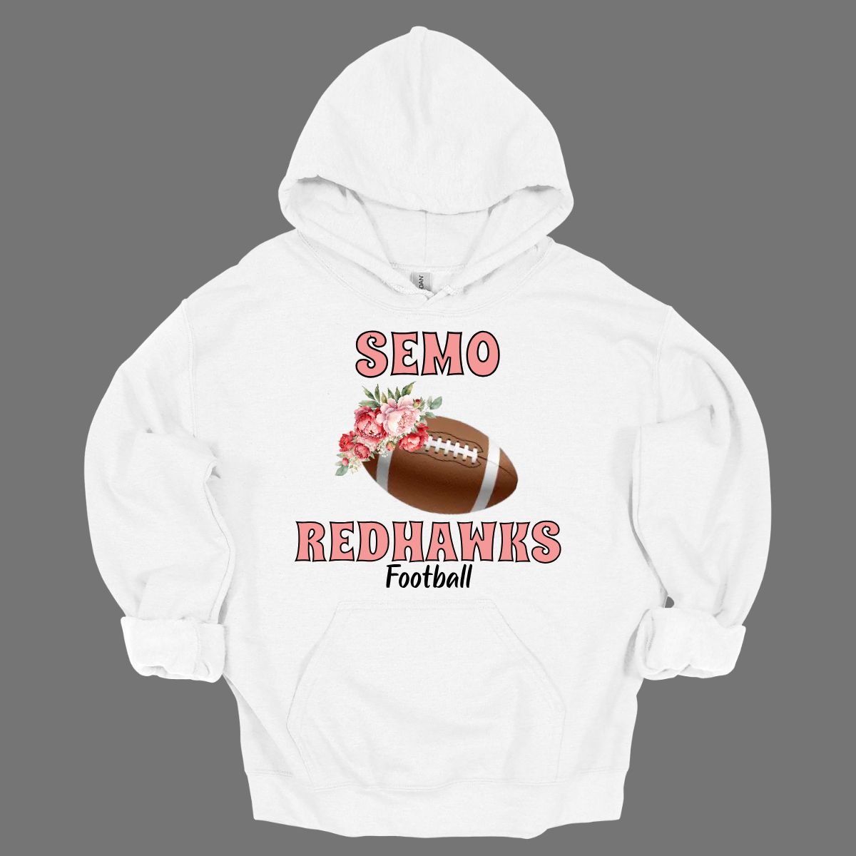 This SEMO hoodie features bold pink SEMO Redhawks lettering across the front, making your pride stand out in eye-catching fashion. A detailed football is accented with delicate flowers adds a unique, feminine twist, while the finishing touch of bold black Football lettering ties the look together. This design blends fierce Redhawk energy with a soft, stylish edge.
Shop at Gorgeousware.com today!


