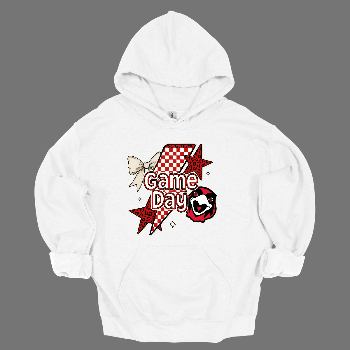 Bring energy to every game with the Game Day Rowdy youth collection! Available in short/ long sleeve, cozy crewneck, and warm hoodie styles. The bold design features a dynamic checkerboard and animal print shooting star, symbolizing the unstoppable energy of the Redhawks. A playful croquette bow adds a fun twist, while the fearless Redhawk takes stage, embodying team strength and spirit. The look is completed with powerful “Game Day” lettering in crisp white. 
Shop at Gorgeousware.com today!
