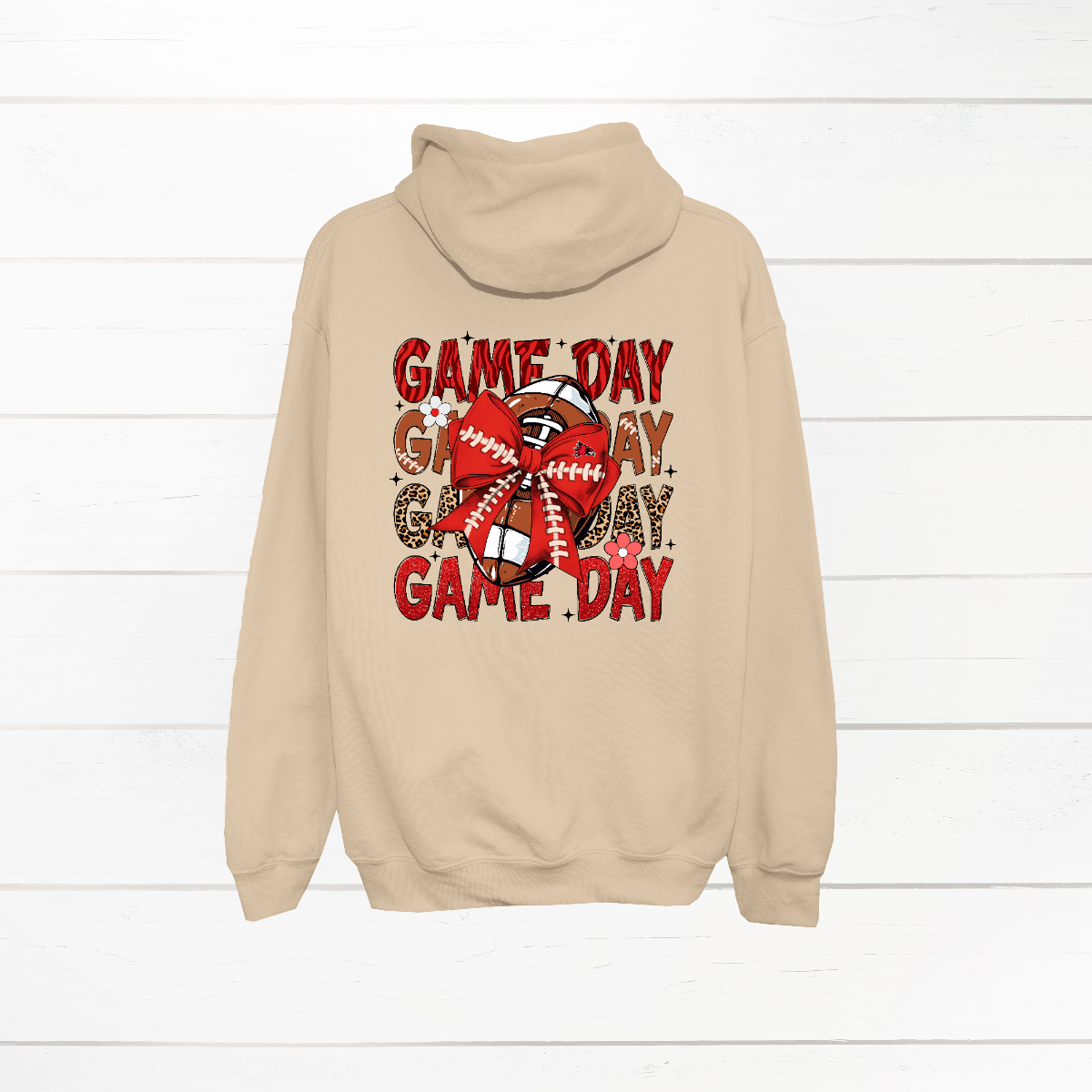 This bold SEMO shirt packs serious team spirit into every detail. The front has a ferocious Redhawk graphic paired with SEMO in bold white lettering over the left chest. The back has “Game Day” repeated in eye catching animal print and football-lace lettering. A football wrapped in a red bow steals the spotlight, complete with football-lace details and a small Redhawk perched on the bow. Go Redhawks! 
Shop at Gorgeousware.com today!
