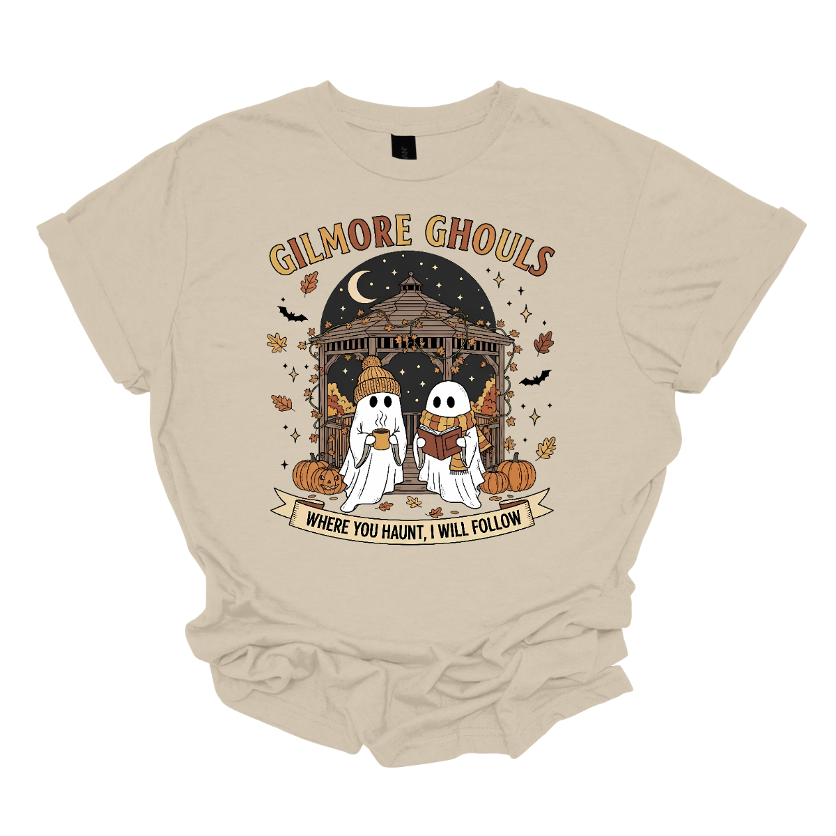 Calling all Gilmore Girls fans with a love for spooky season! 👻🍂 This Gilmore Ghouls graphic tee is the perfect mix of cozy and creepy-cute. The design features two friendly ghosts standing under a gazebo — one sipping a steaming mug, the other lost in a good book. The backdrop is filled with glowing jack-o’-lanterns, pumpkins, fluttering bats, and falling autumn leaves for the ultimate fall aesthetic. Shop at Gorgeousware.com