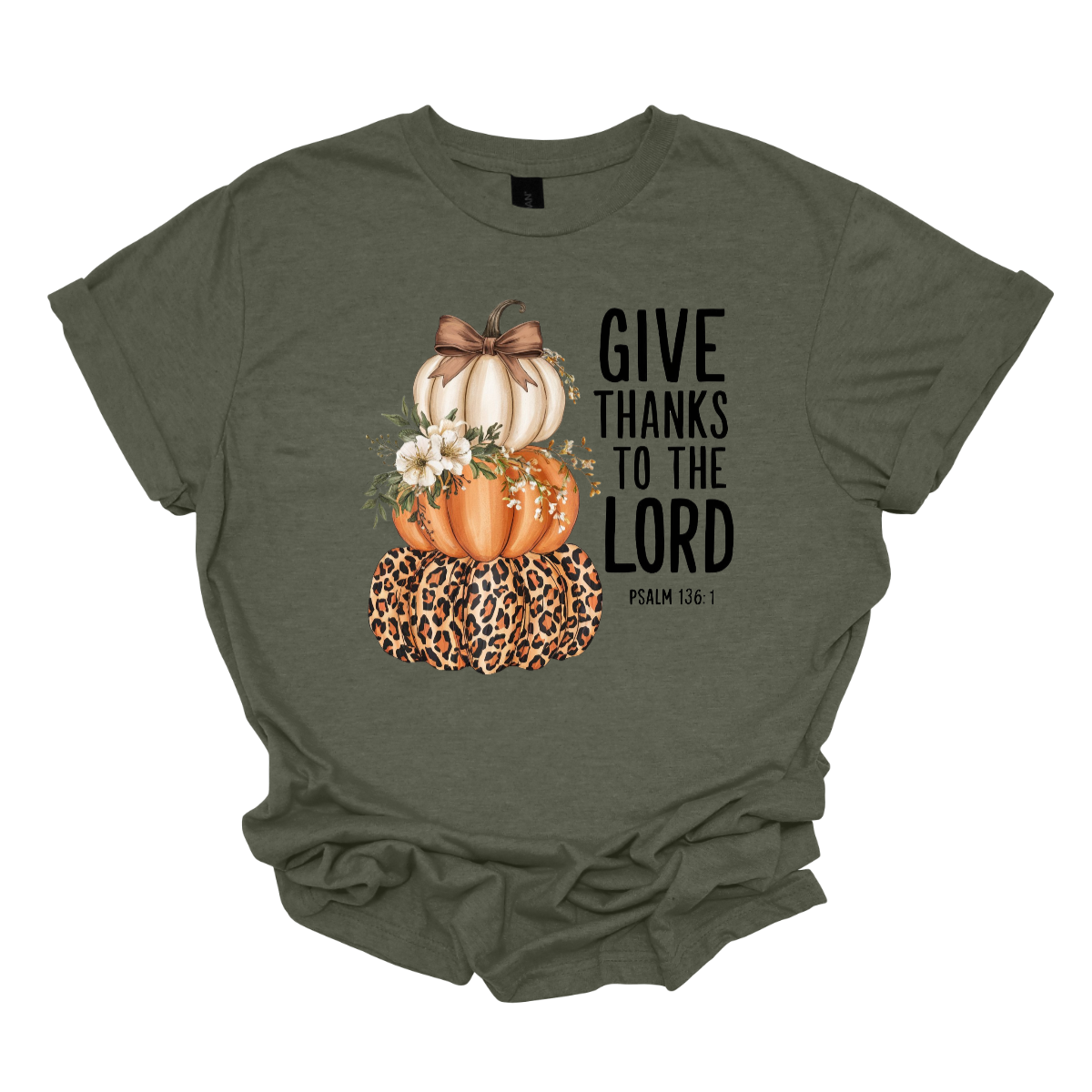 Celebrate the season of gratitude with this beautiful fall graphic tee! The design features a charming stack of three pumpkins — cream, orange, and leopard print — topped with a bow and accented with soft cream-colored flowers between the second and third pumpkin. To the right, in bold lettering, the verse “Give thanks to the Lord – Psalms 136:1” is displayed, making this the perfect faith-inspired fall shirt. Shop at Gorgeousware.com