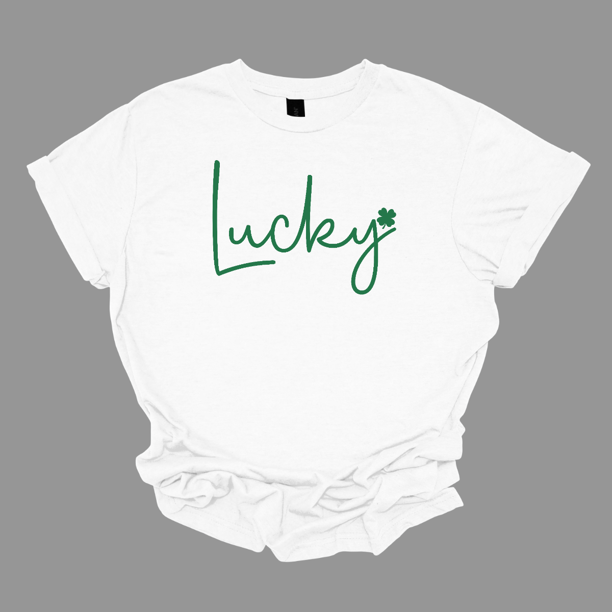 ☘️ Get Lucky this St. Patrick's Day with our Shamrock Tee! ☘️  Embrace the spirit of the Irish and celebrate St. Patrick's Day in style with our simple yet charming "Lucky" T-shirt. Featuring a vibrant green word that exudes luck and a small shamrock at the end, this tee is the perfect way to add a touch of festive cheer to your wardrobe. Shop at Gorgeousware.com today!