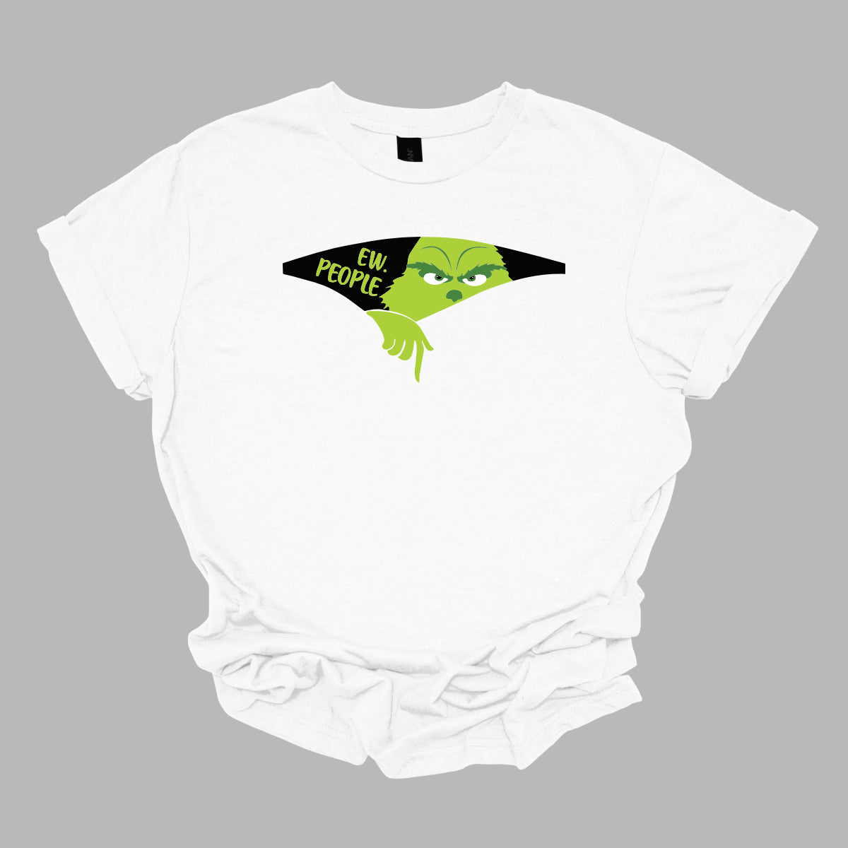 This T-shirt features a playful and eye-catching design centered around a cut-out illusion. The shirt showcases a dynamic cut-out effect, creating the appearance that a section of the fabric has been torn away. Through this cut-out, the Grinch is depicted in vivid, cartoonish detail, as though he’s emerging from the hole saying "Ew. People". Shop Gorgeousware.com