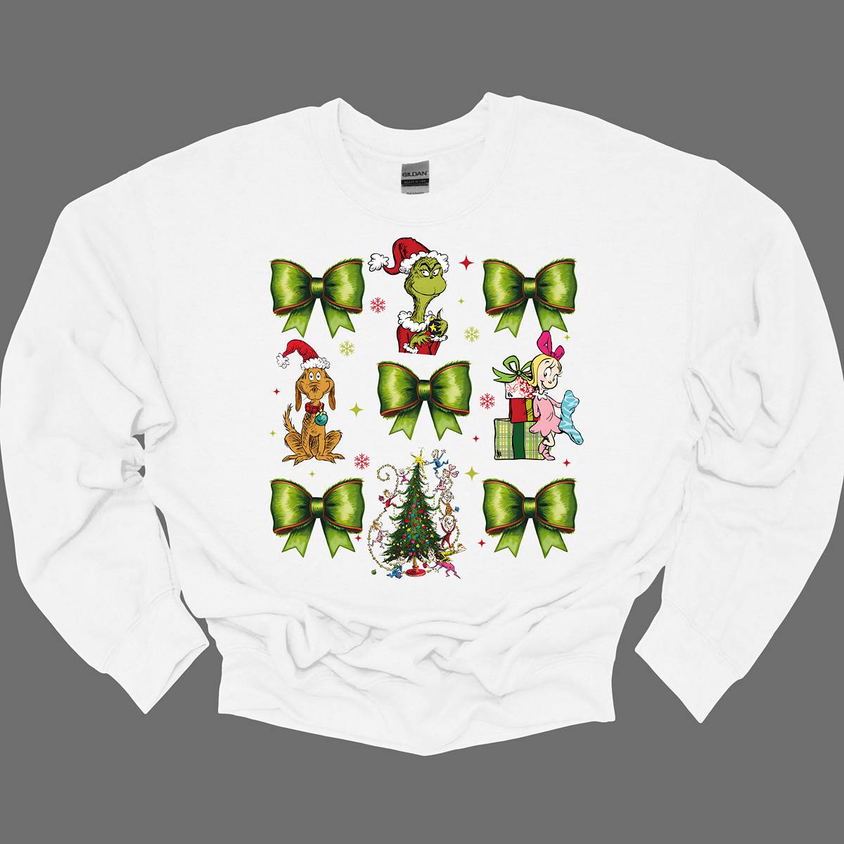 This whimsical apparel features a charming "Grinch Croquette" design with a playful 9-image grid, bringing the beloved characters and scenes from How the Grinch Stole Christmas to life. The grid showcases a combination of green bows, the mischievous Grinch, his loyal dog Max, and the sweet Cindy Lou Who, all set against the backdrop of the iconic whimsical Christmas tree.  Shop at Gorgeousware.com