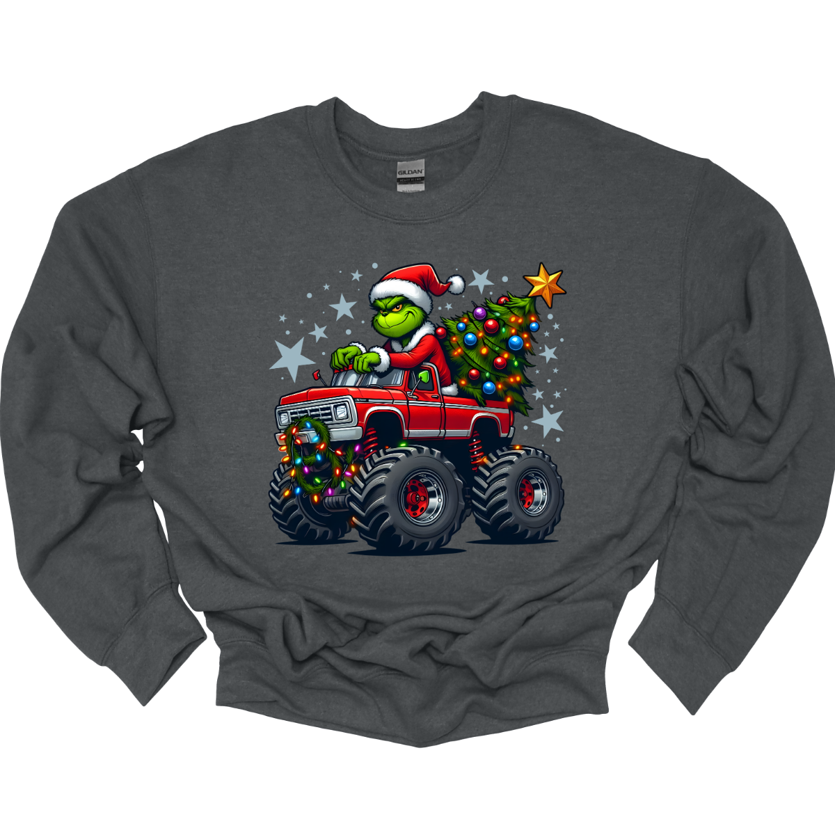 Grey sweat shirt with a graphic of a Grinch driving a monster truck with a Christmas tree, on a white background. Shop at Gorgeousware.com