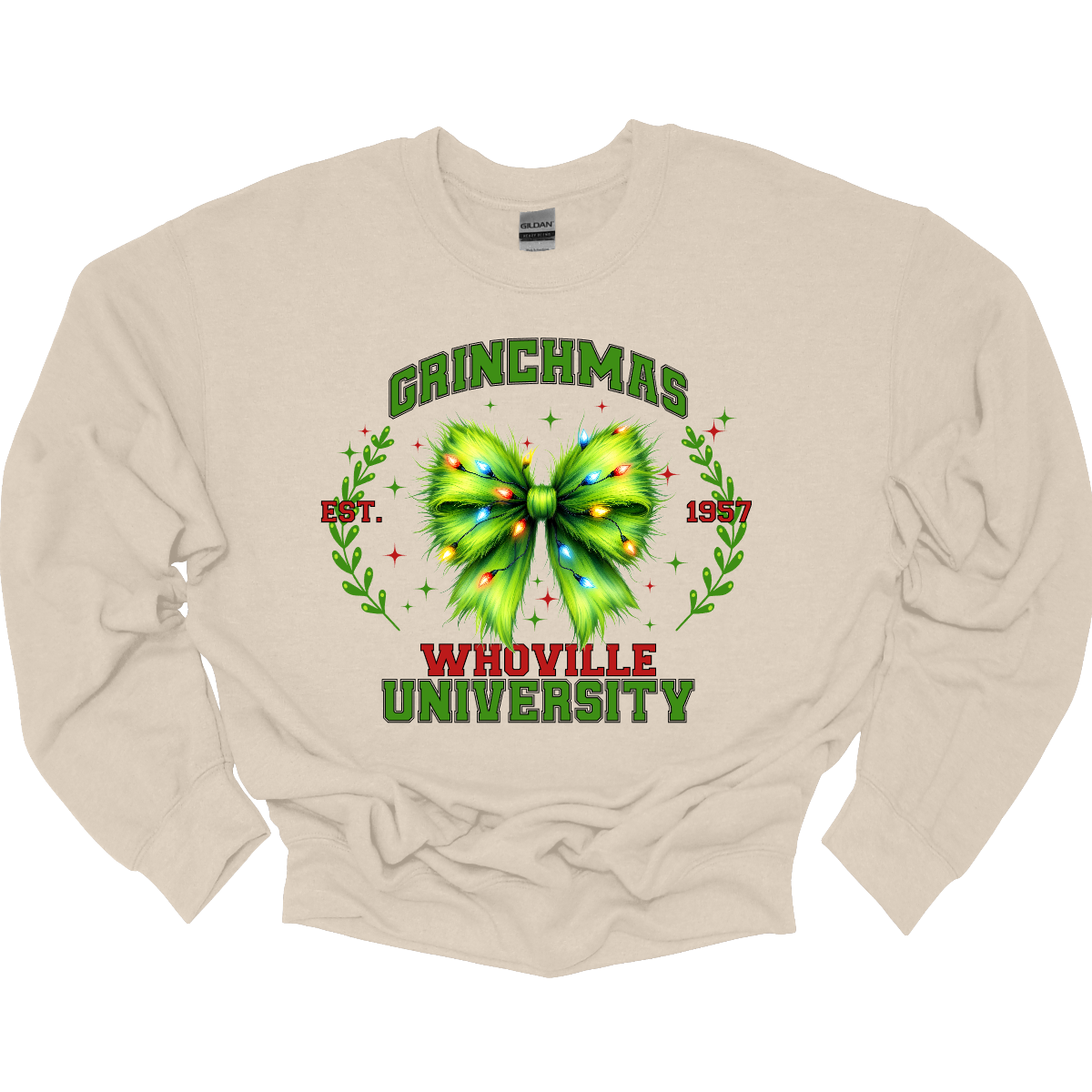 This festive apparel features the bold, collegiate-style lettering of "Grinch Whoville University" across the chest, giving it a spirited, school pride look. At the center of the design, a vibrant green Grinch-inspired croquet bow adds a playful touch, adorned with colorful Christmas lights, making the outfit perfect for the holiday season. Shop at Gorgeousware.com