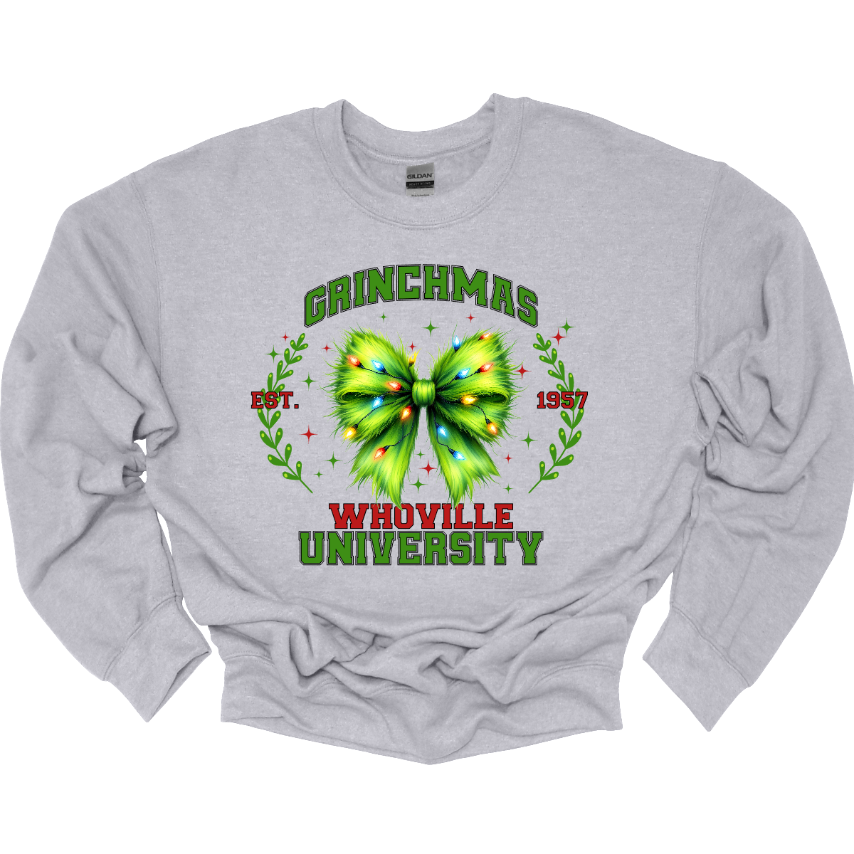 This festive apparel features the bold, collegiate-style lettering of "Grinch Whoville University" across the chest, giving it a spirited, school pride look. At the center of the design, a vibrant green Grinch-inspired croquet bow adds a playful touch, adorned with colorful Christmas lights, making the outfit perfect for the holiday season. Shop at Gorgeousware.com