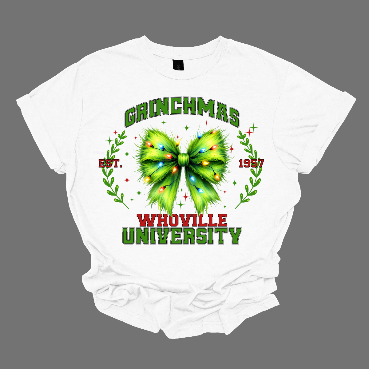 This festive apparel features the bold, collegiate-style lettering of "Grinch Whoville University" across the chest, giving it a spirited, school pride look. At the center of the design, a vibrant green Grinch-inspired croquet bow adds a playful touch, adorned with colorful Christmas lights, making the outfit perfect for the holiday season. Shop at Gorgeousware.com