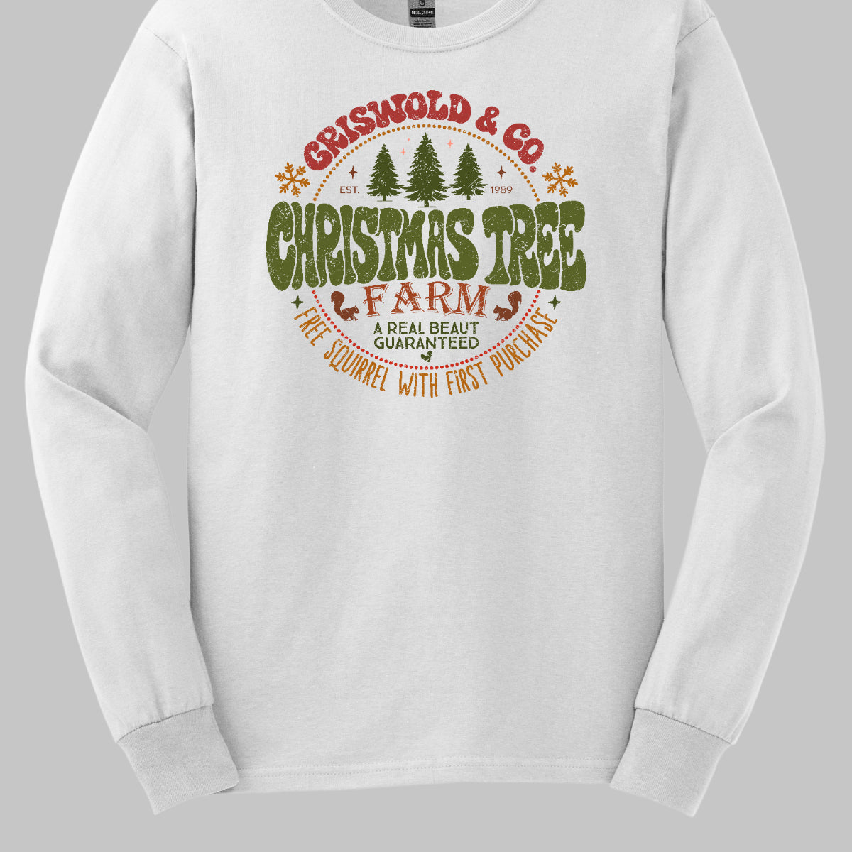 This festive t-shirt captures the spirit of holiday fun with a design inspired by classic Christmas cheer. The shirt features the words “Christmas Tree Farm” prominently displayed, with “Christmas Tree” in vibrant green bubble letters that pop with playful energy.Encircling this central text is “Griswold &amp; CO.,” giving it a nostalgic nod to the iconic family from holiday movie lore. Surrounding the main text are memorable quotes from the movie. Shop Gorgeousware.com