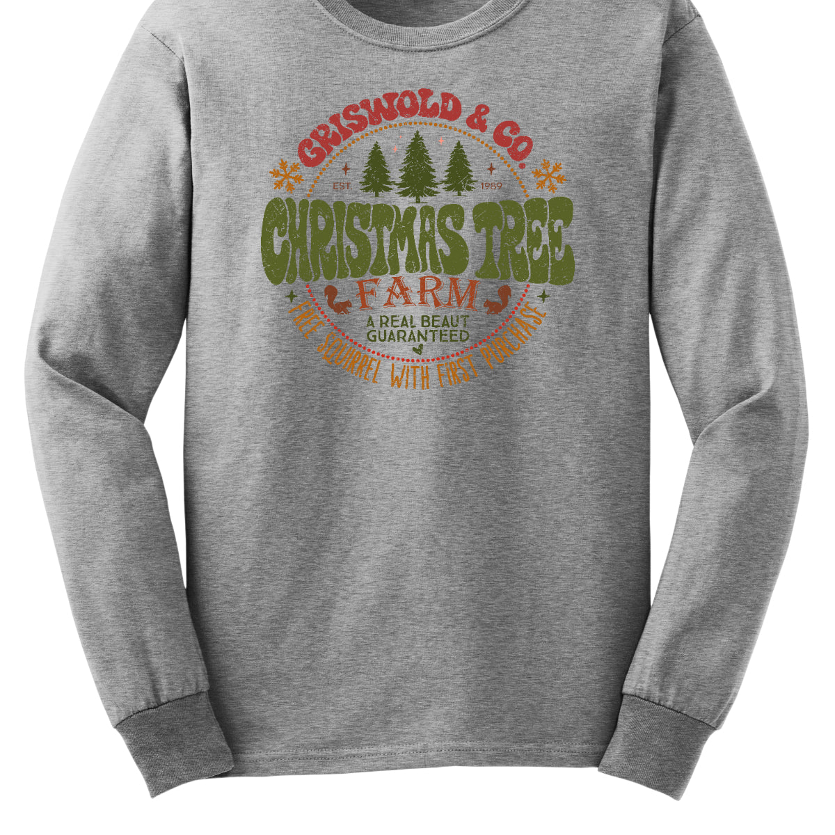 This festive t-shirt captures the spirit of holiday fun with a design inspired by classic Christmas cheer. The shirt features the words “Christmas Tree Farm” prominently displayed, with “Christmas Tree” in vibrant green bubble letters that pop with playful energy.Encircling this central text is “Griswold &amp; CO.,” giving it a nostalgic nod to the iconic family from holiday movie lore. Surrounding the main text are memorable quotes from the movie. Shop Gorgeousware.com