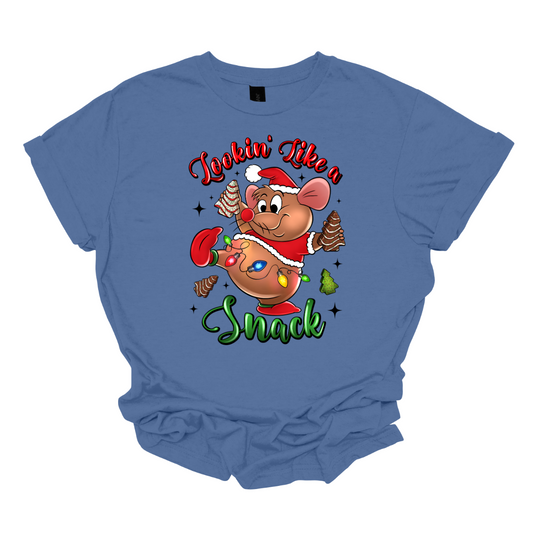 Blue t-shirt with a cartoon mouse, Gus Gus, holding a Christmas snack and text 'Lookin' Like a Snack' on a white background. Shop at Gorgeousware.com