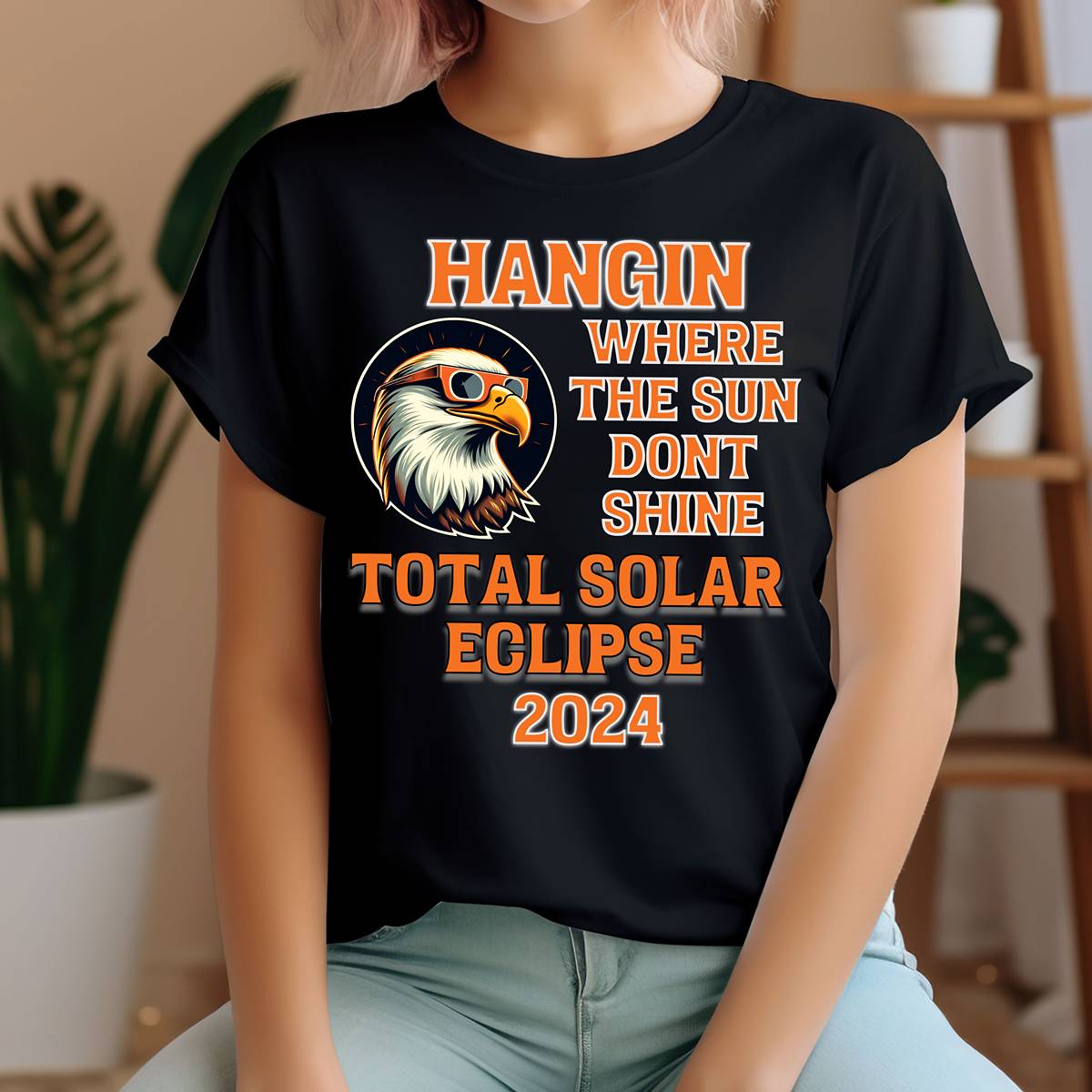 Embrace your cosmic sense of humor with our 'Hangin' Where the Sun Don't Shine' solar eclipse t-shirt! This playful design captures the essence of the celestial event in a lighthearted and witty way. Featuring bold lettering while the bald eagle takes in the solar eclipse, it's sure to draw smiles and chuckles from all who see it. Shop at Gorgeousware.com